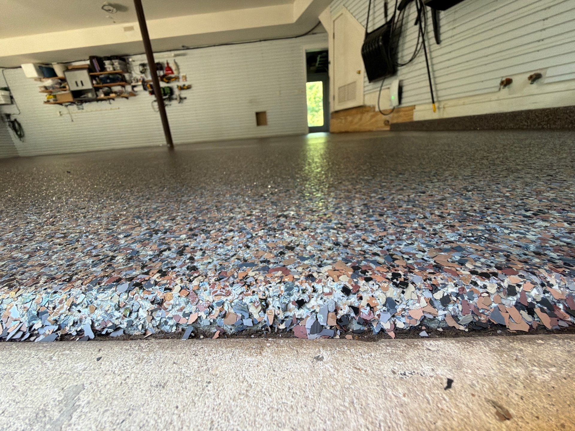 Residential Garage Epoxy Flake Floor Installation in Grand Haven by Gordon Painting
