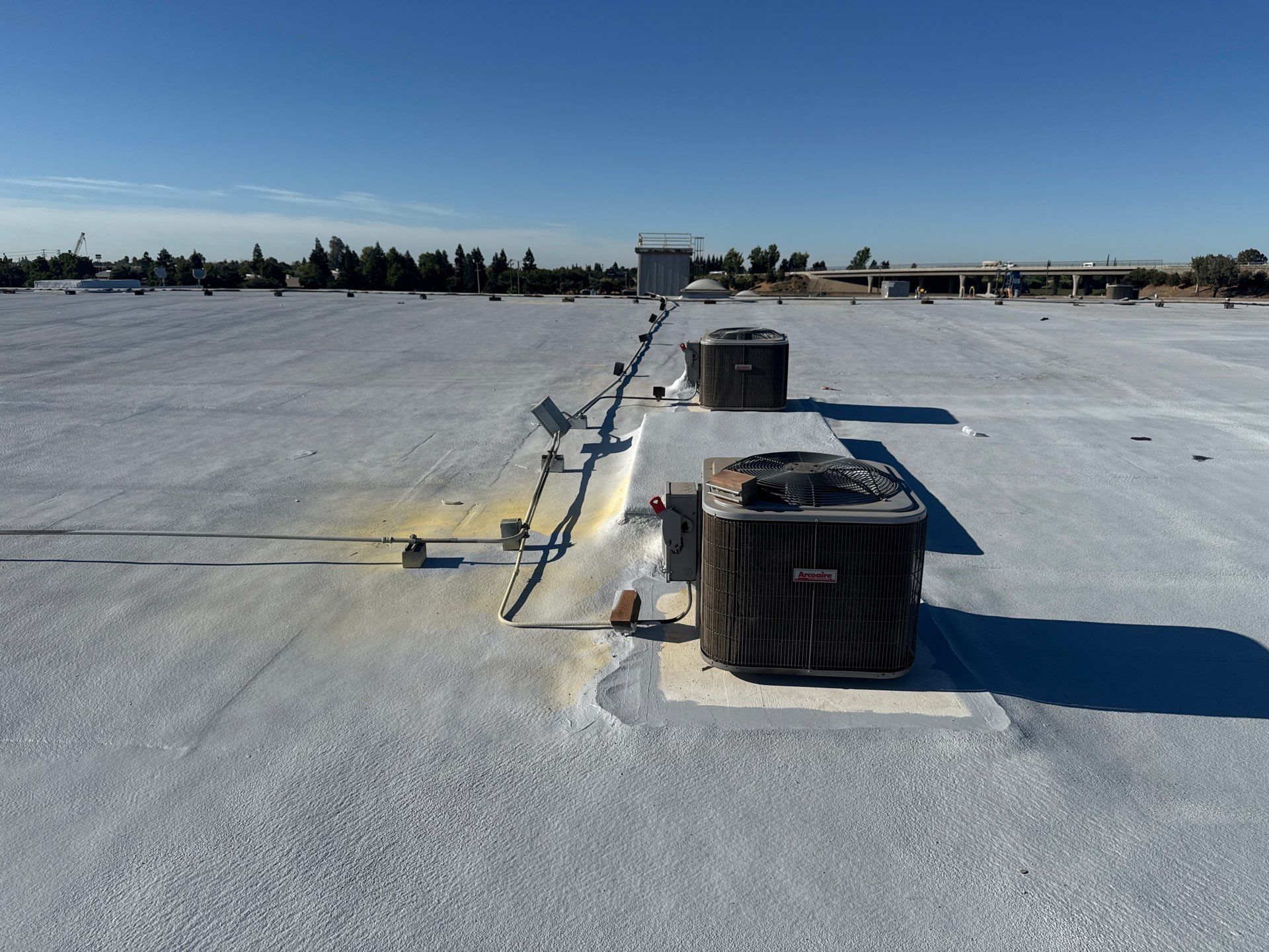 Pro Farms Spray foam roofing project by Straight Edge Roofing Inc