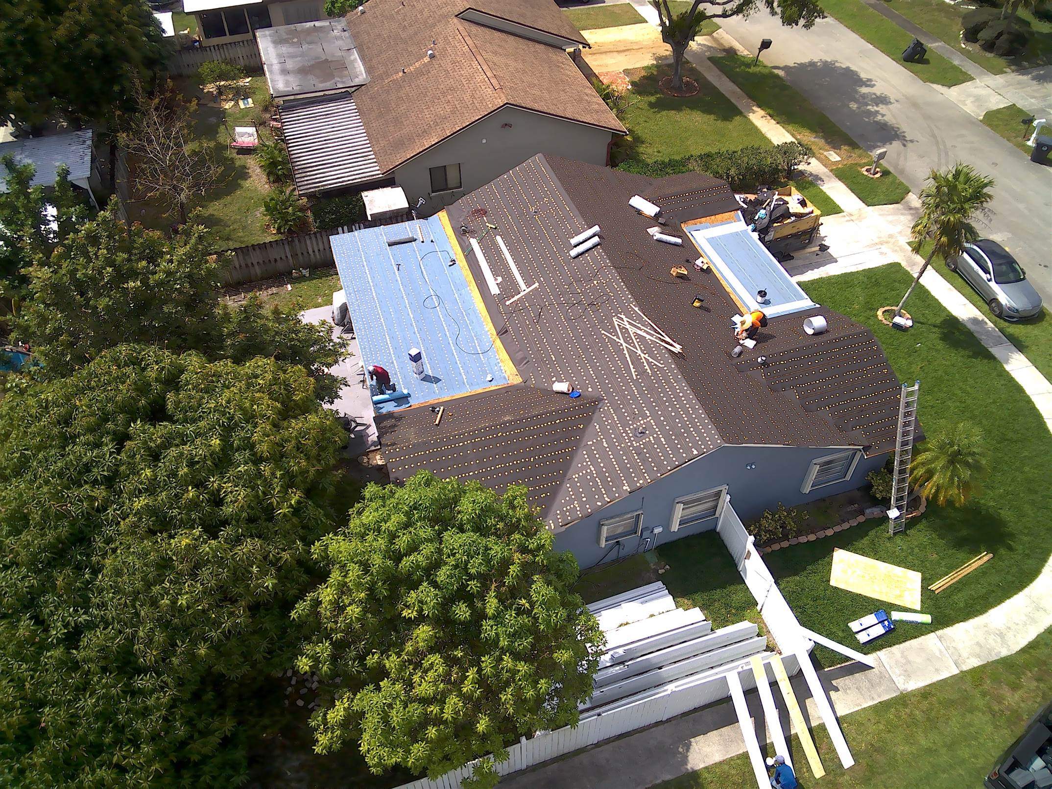 Standing Seam Metal & Flat Re-Roof using 1.5" Nail Strip 24ga Solar White Kynar Coated Standing Seam Metal Panels by Morton Roofing, Inc.