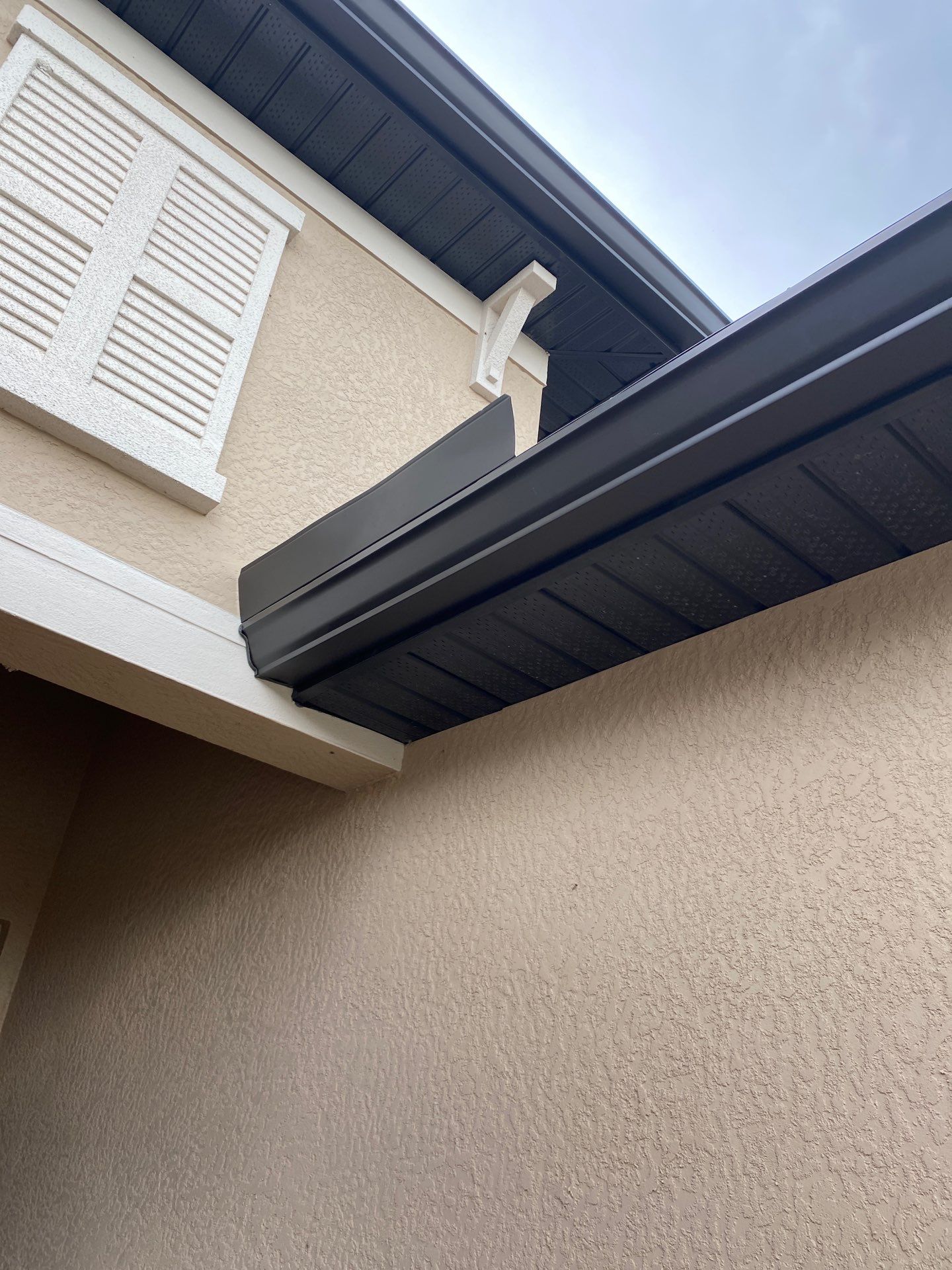 Brown Seamless Gutters for Homes in Fort Myers by Gutter Professors