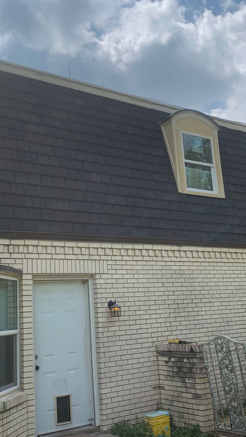 Mansard Charm by Bayfront Roofing and Construction