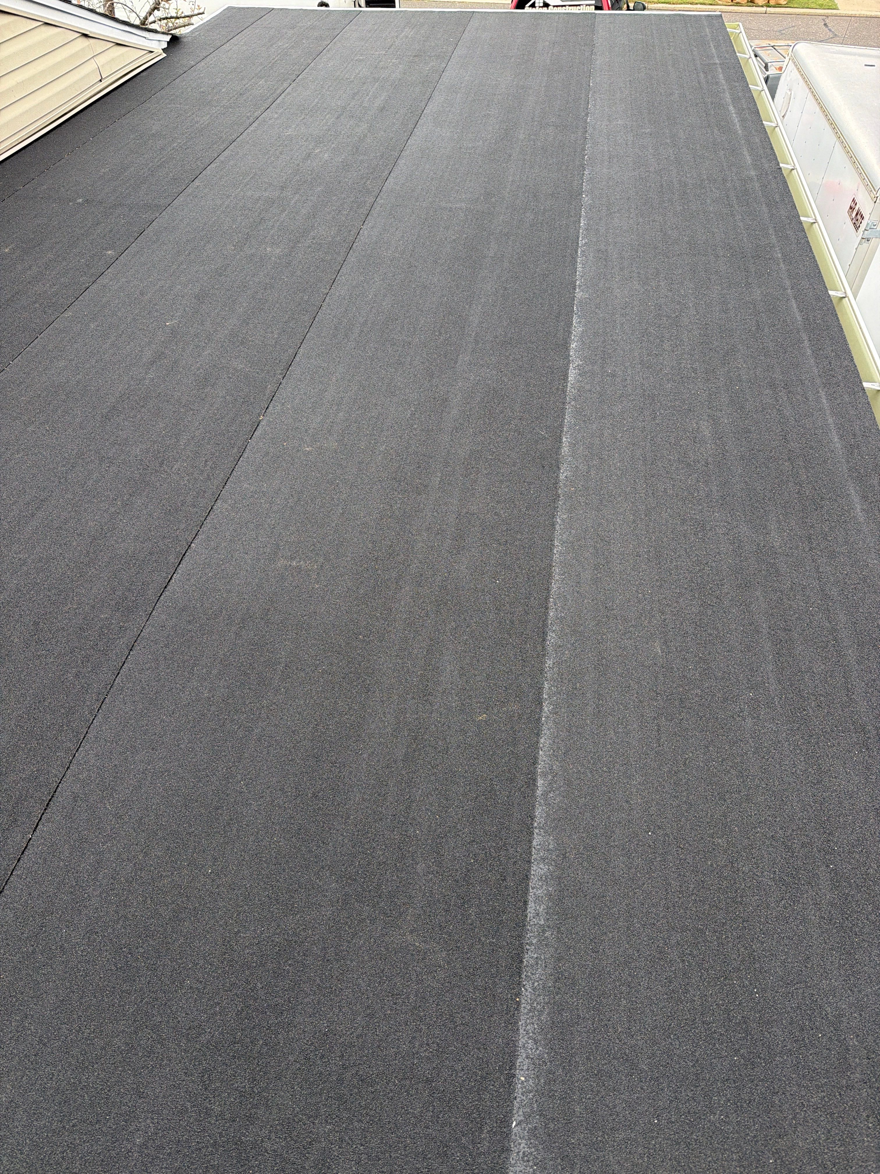 Flat Roof Replacement and Shingle Integration in Levittown by Stofan Construction LLC