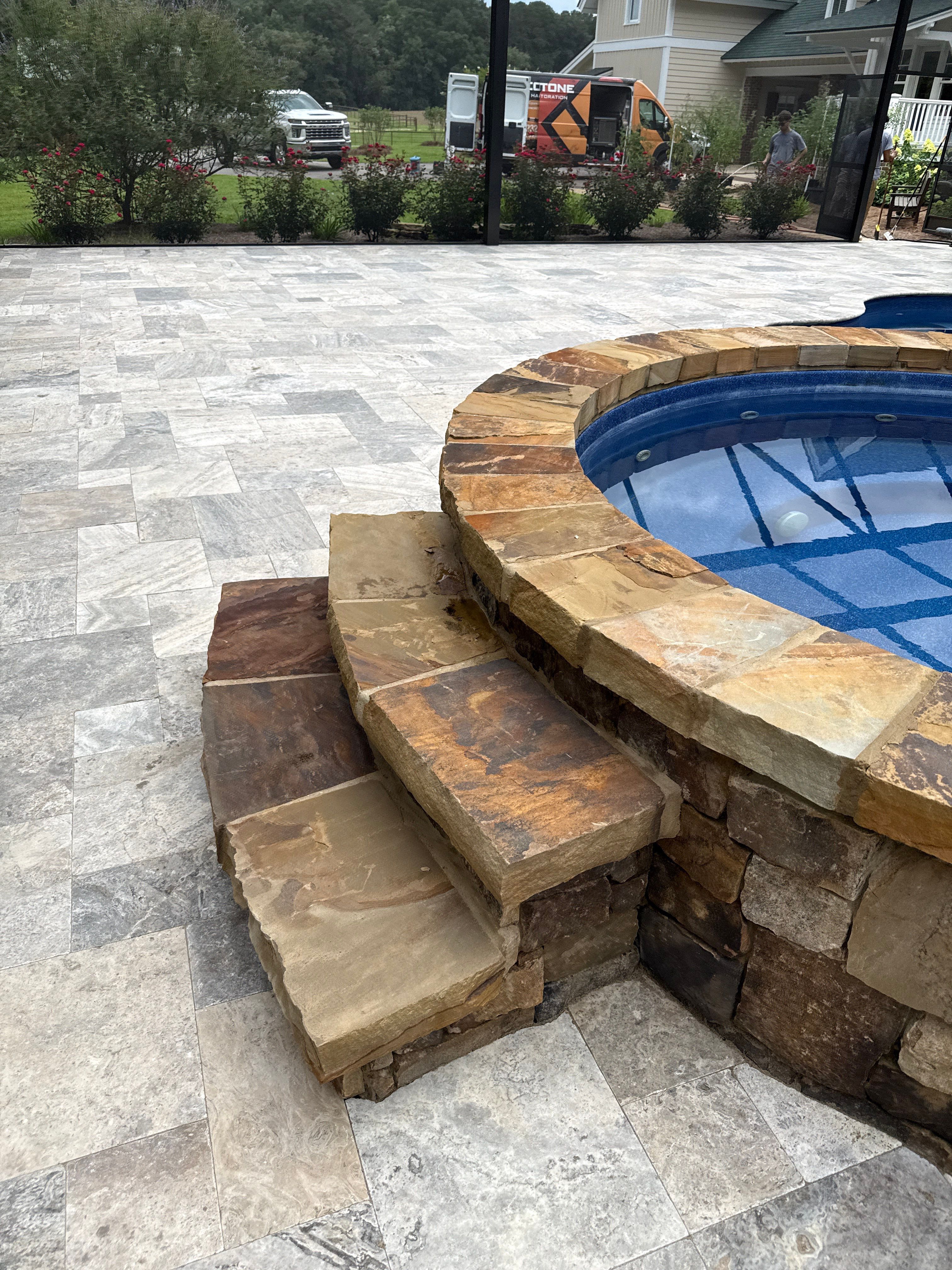 Travertine Patio and Natural Stone Spa in Brantley by Cornerstone Hard Surface Restoration 