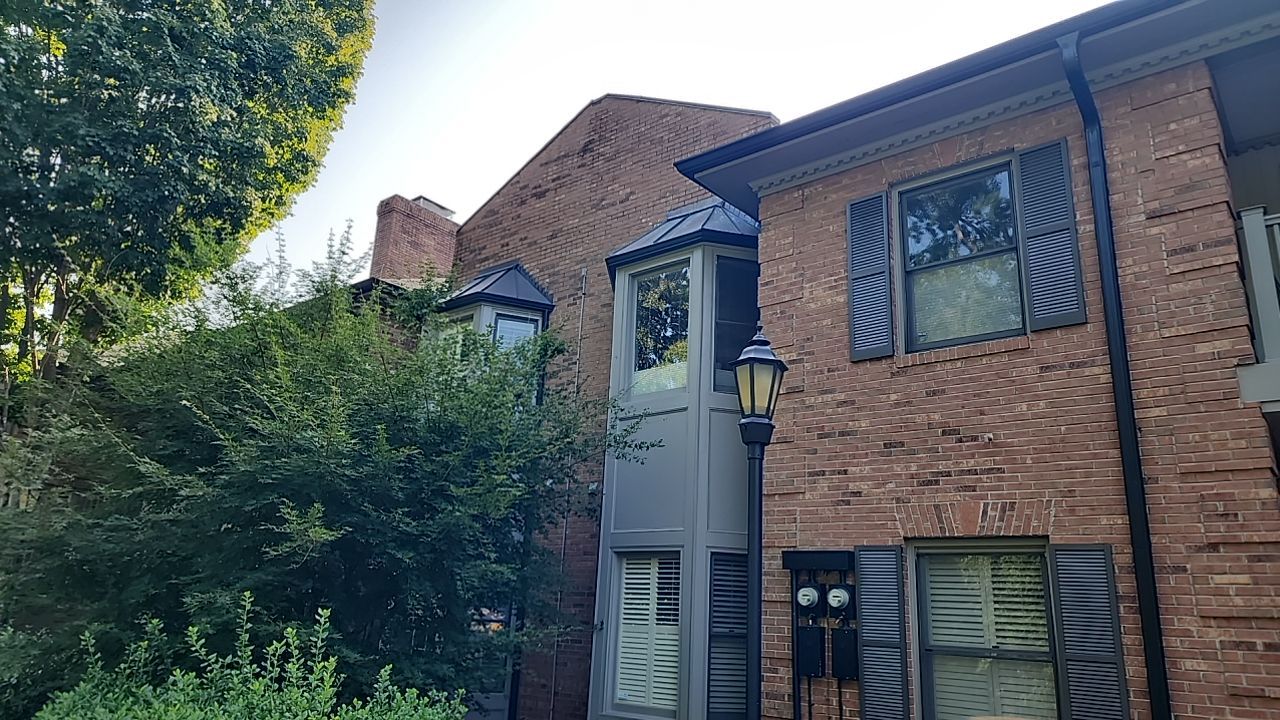 building clean using cleaner by Power Wash Masters LLC