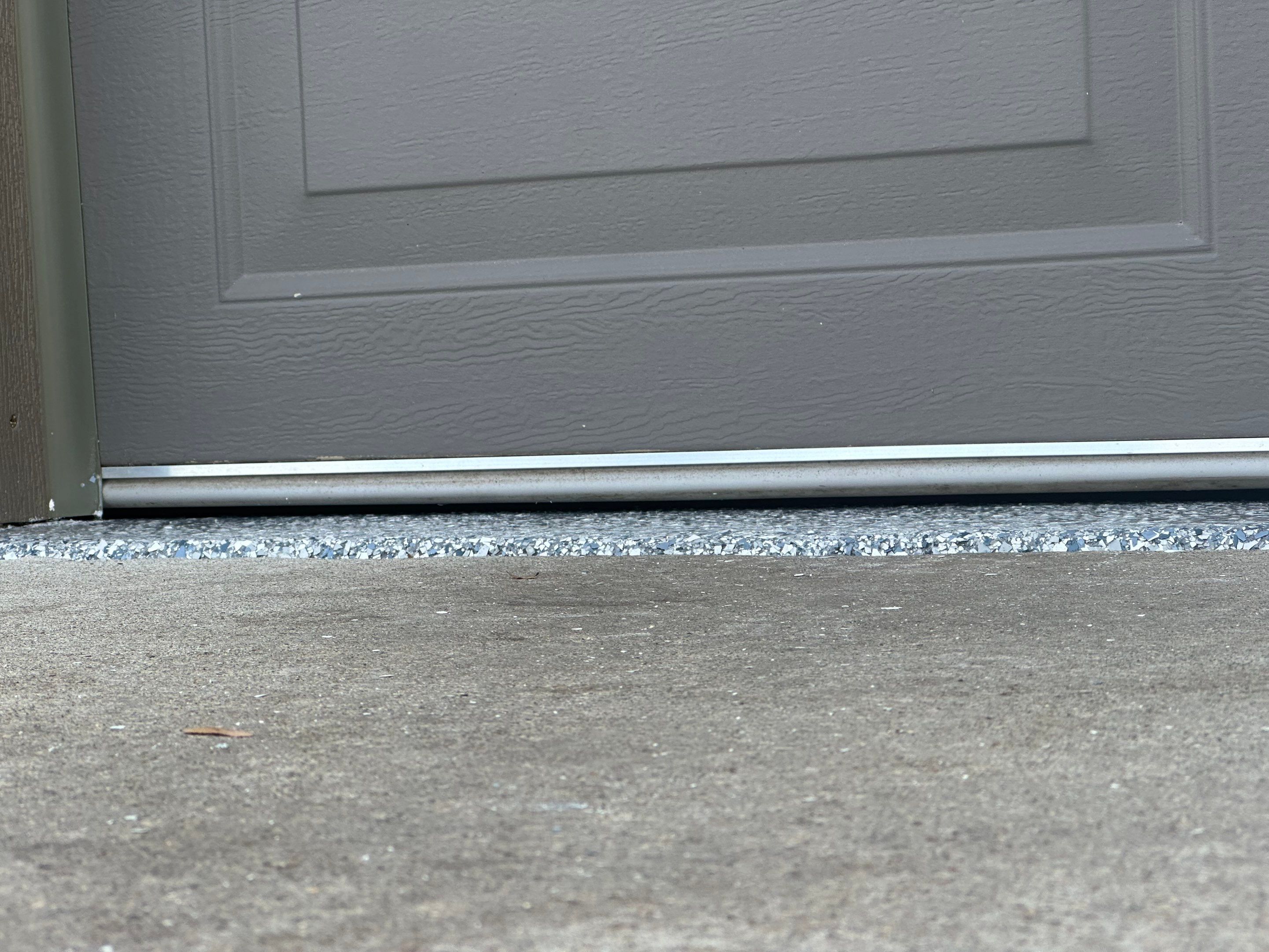 Multi-Colored Speckled Concrete Floor Coating Installation in Sioux Falls by Select Painting, Coatings & Garage Cabinets