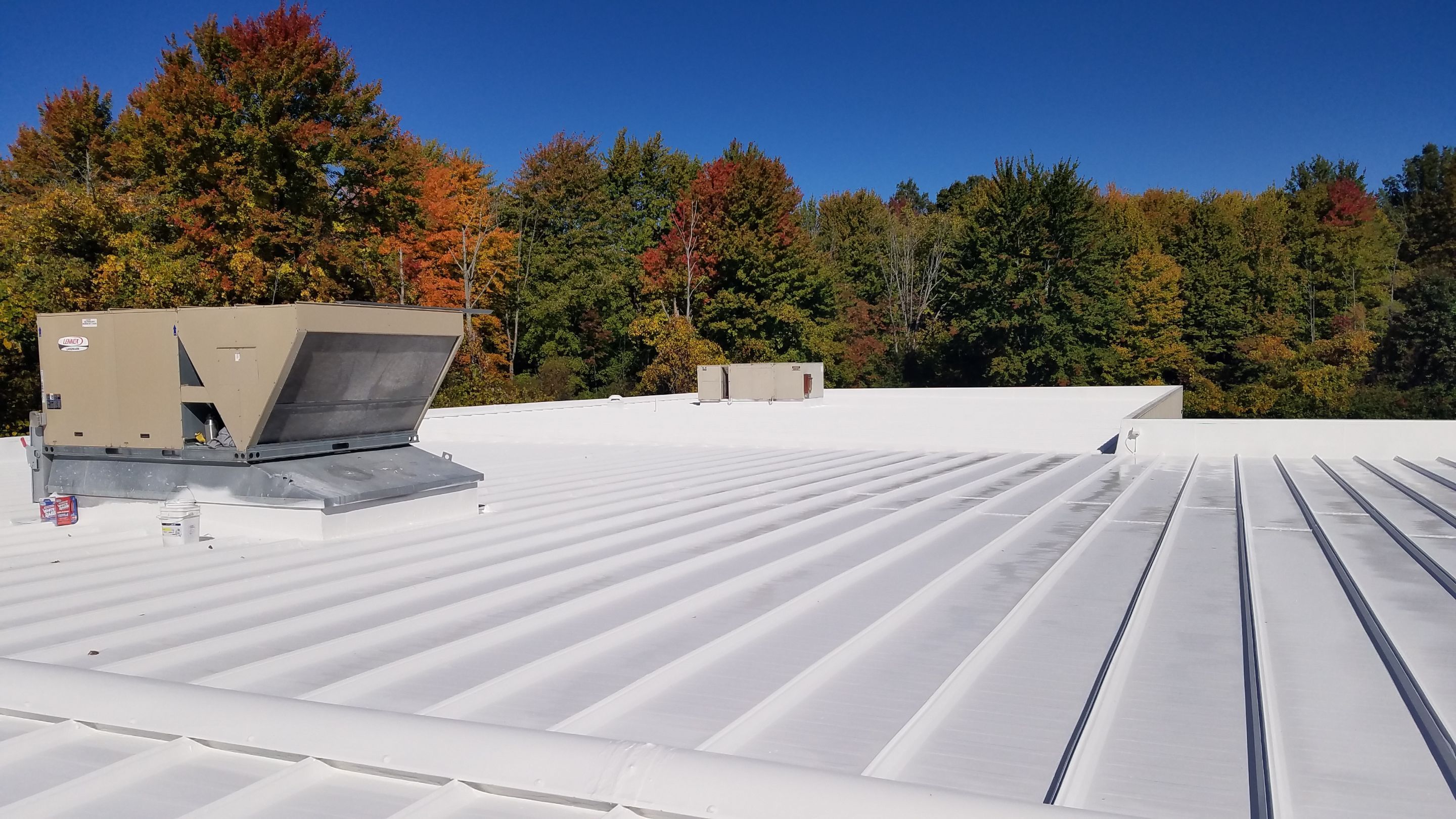 Commercial Metal Roof Coating by Gold Star Roofing LLC