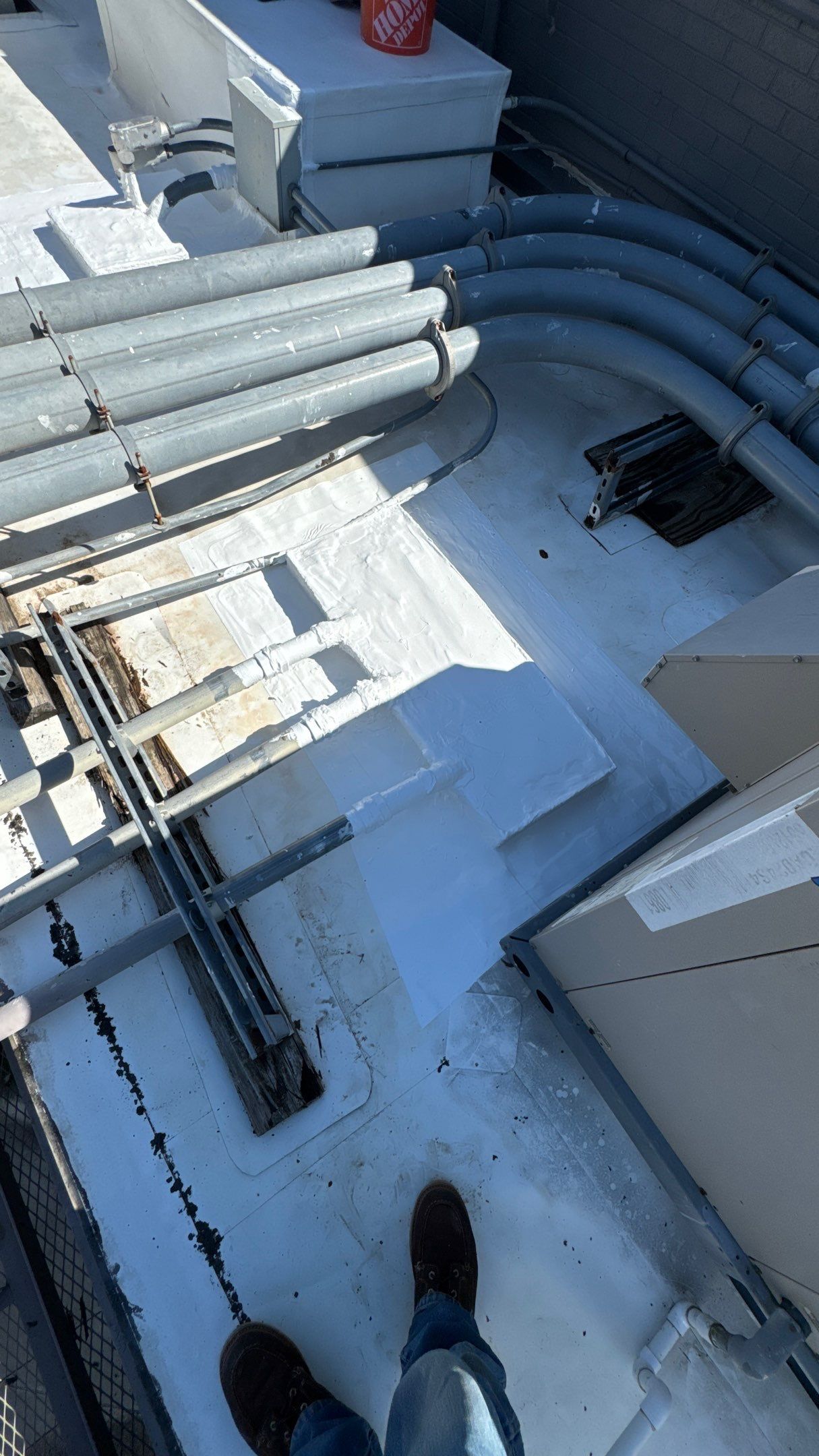Commercial Roofing Repair using TRP #924 Eterna-Sil Premium Silicone Roof Coating by Harvey Roofing & Construction
