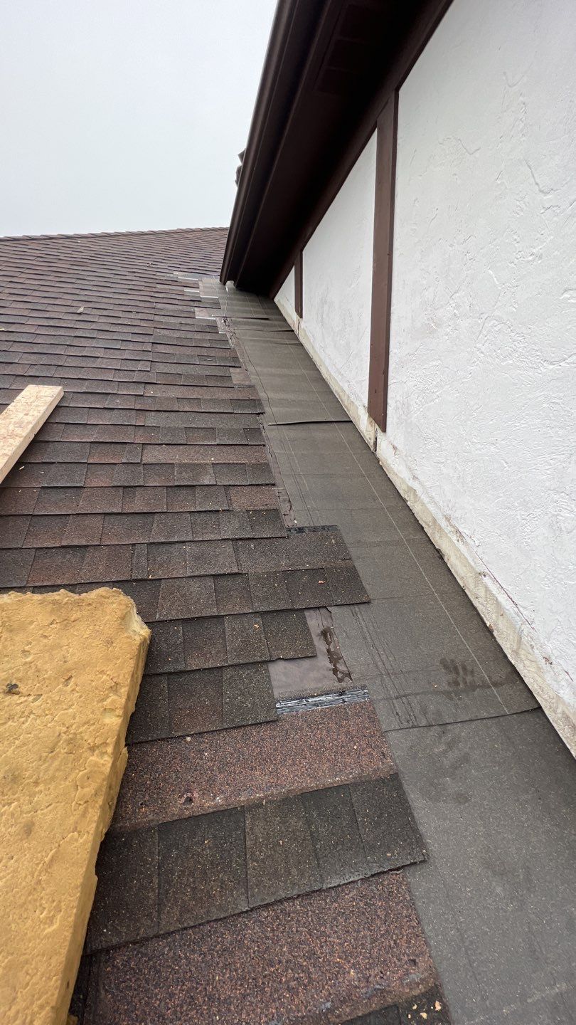 Step flashing repair on roof to wall by Pro Home Services Inc