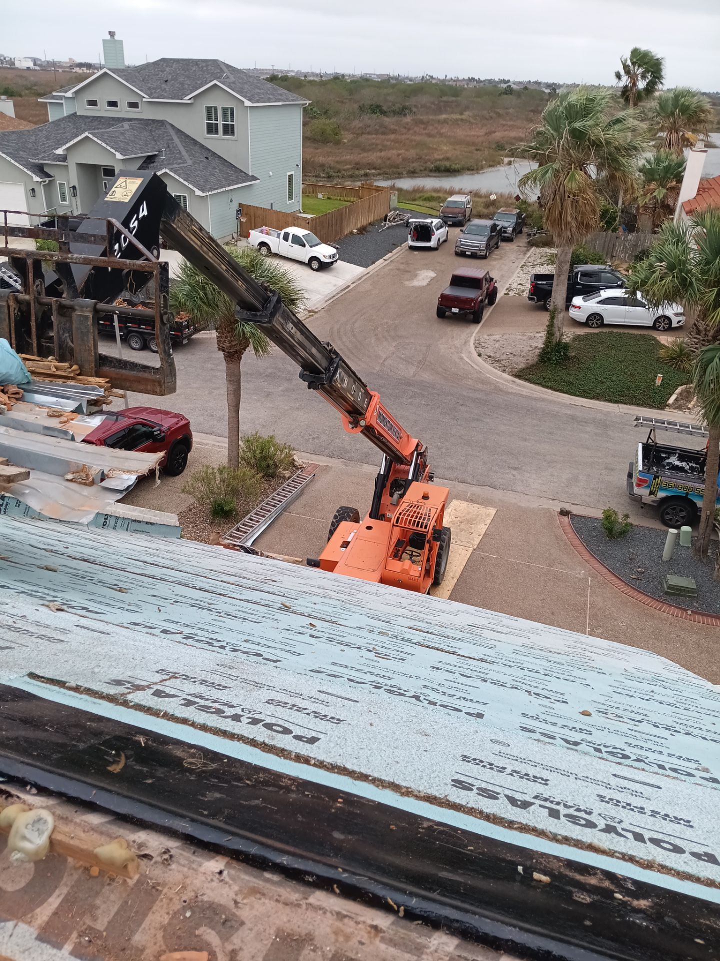 Off with the Tile and on with the TILCOR stone coated metal.  by Bayfront Roofing and Construction