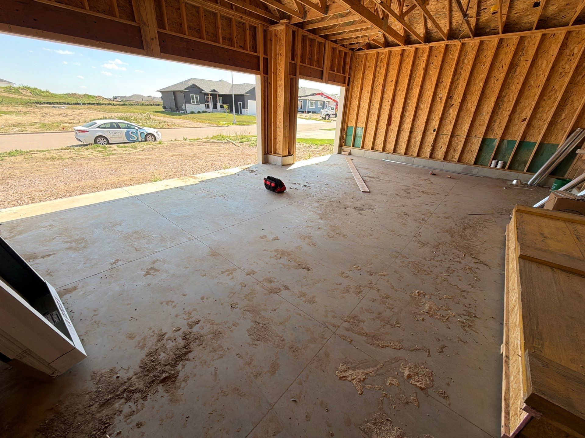 Grey Speckled Garage Floor Coating in Sioux Falls by Select Painting, Coatings & Garage Cabinets