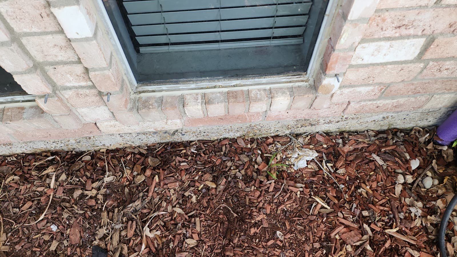 Colored Vinyl Windows to blend into brick by Bayfront Roofing and Construction