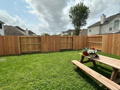 Wood fence with alternating panels