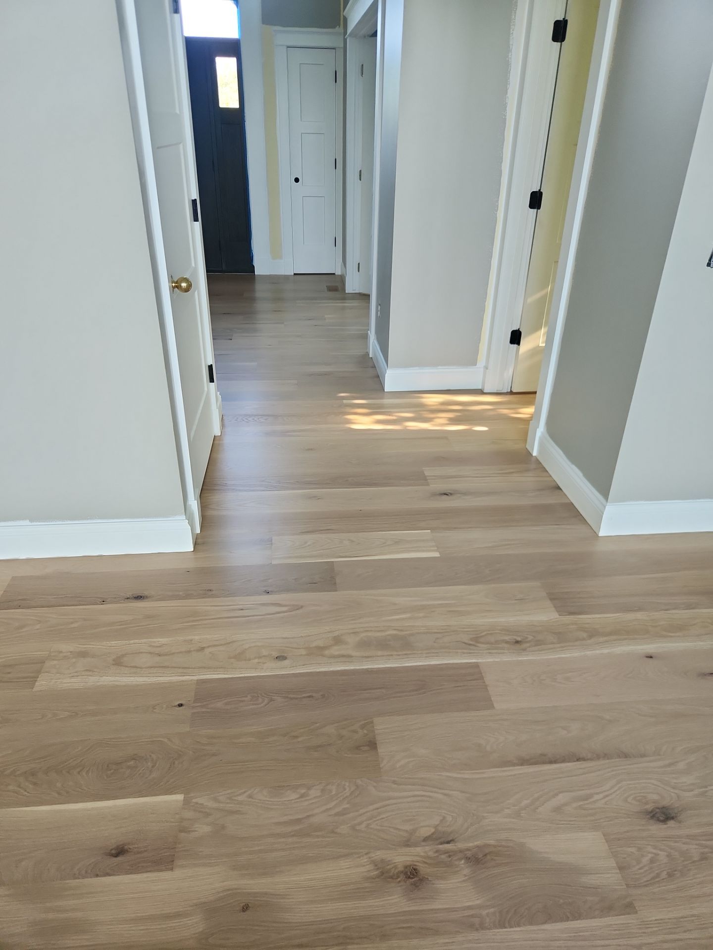  7 inch wide engineered  White Oak site sand and finish by Ann Arbor Hardwoods 