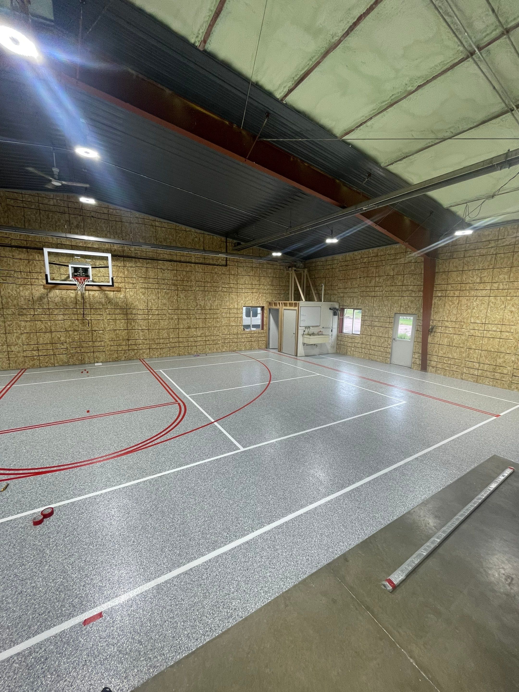 Custom Polyurea Shop Floor with Basketball Court Lines in Rock Valley by Select Painting, Coatings & Garage Cabinets