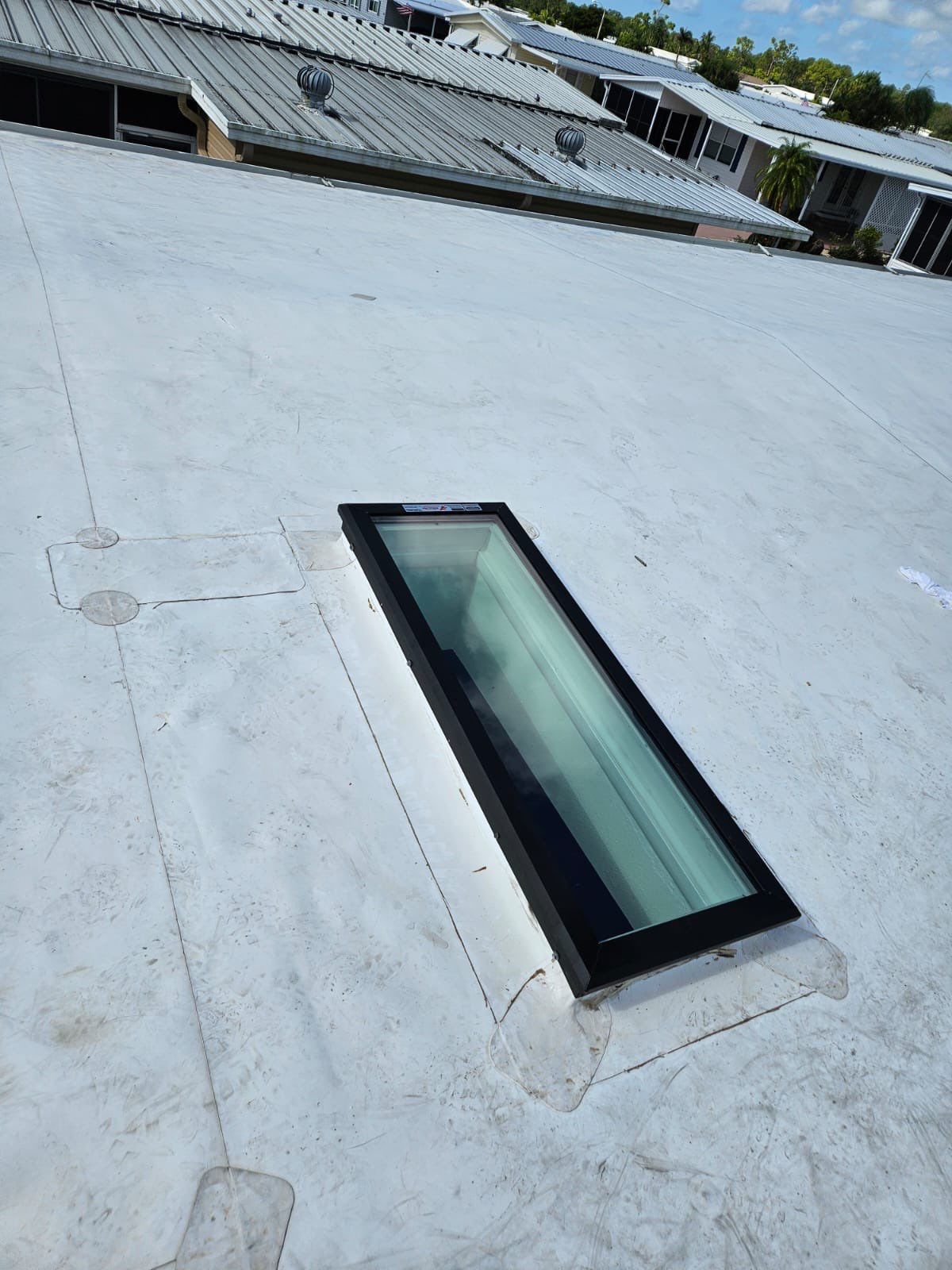 Residential TPO and Skylight Installation by Four Peaks Roofing