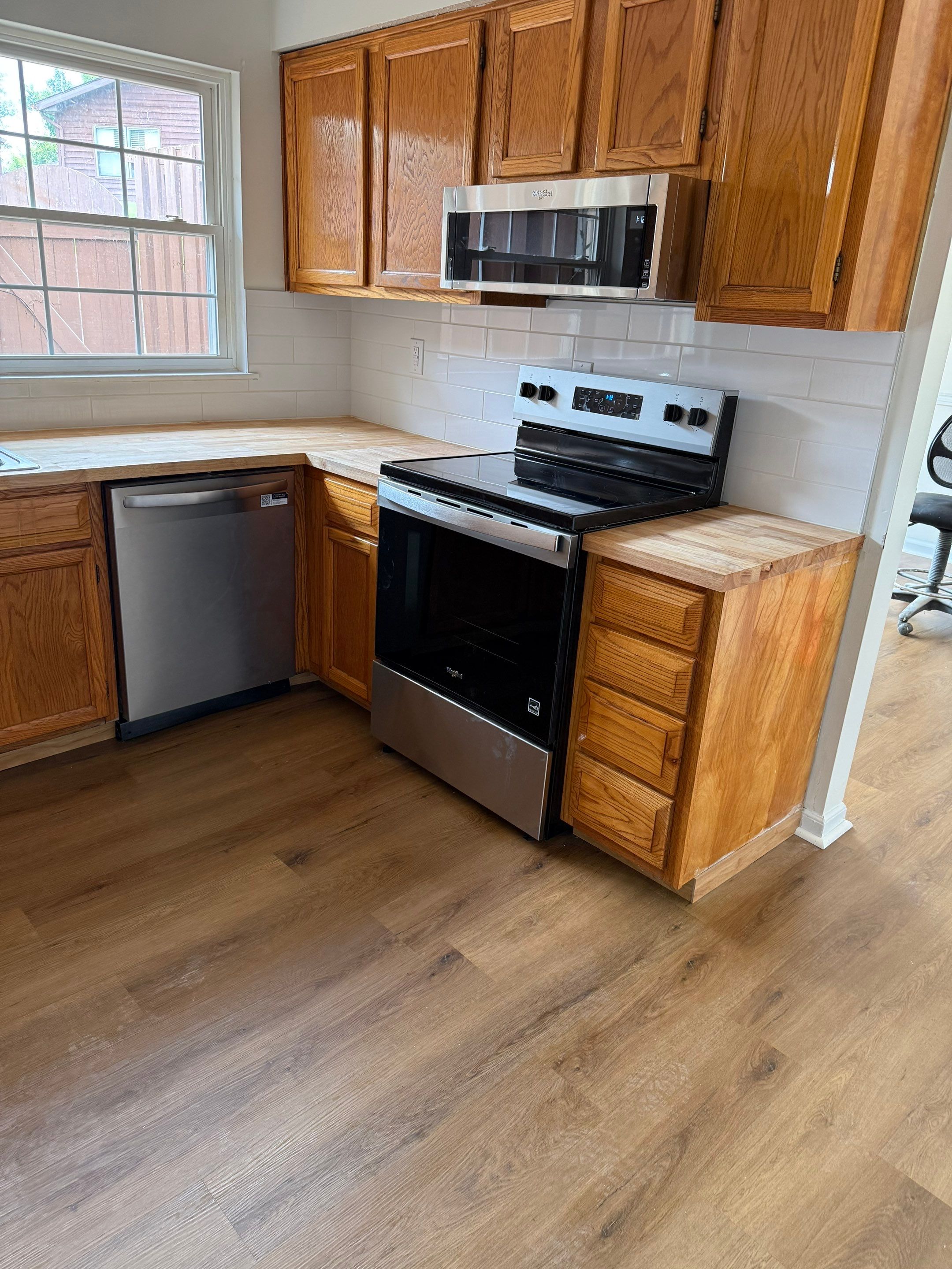 Complete Home Remodel Featuring Custom Kitchen and Wood-Look Plank Flooring by MAJO