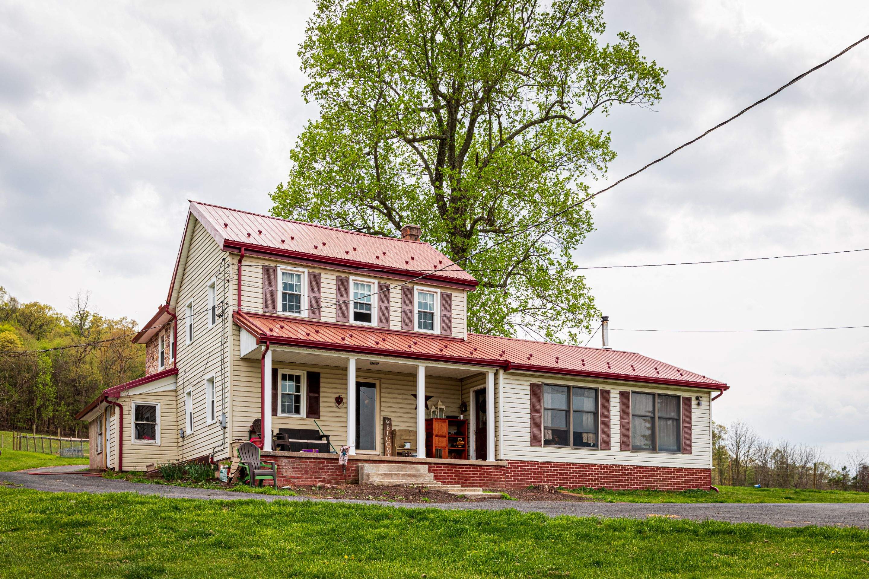 Metal Roof-coloniel red- and new siding by Esh Builders