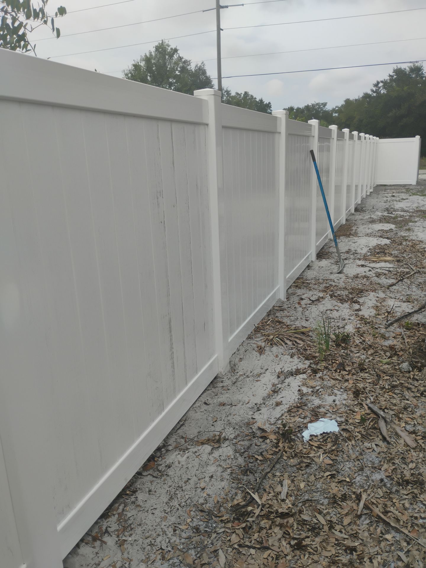 White Vinyl Privacy Fence Installation and Gate Assembly in Punta Gorda by True Fence LLC