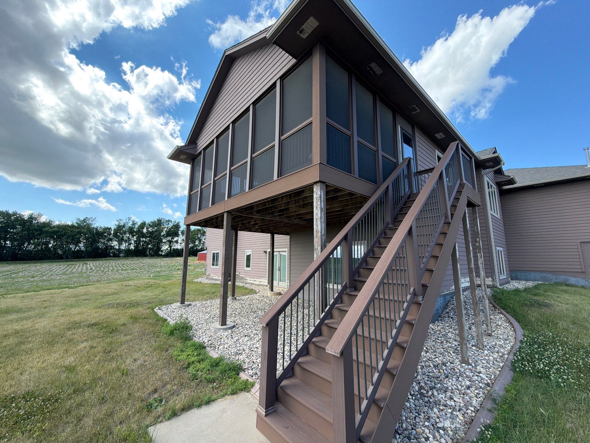 Full Exterior Siding Paint Restoration and Refresh in Garretson by Select Painting, Coatings & Garage Cabinets
