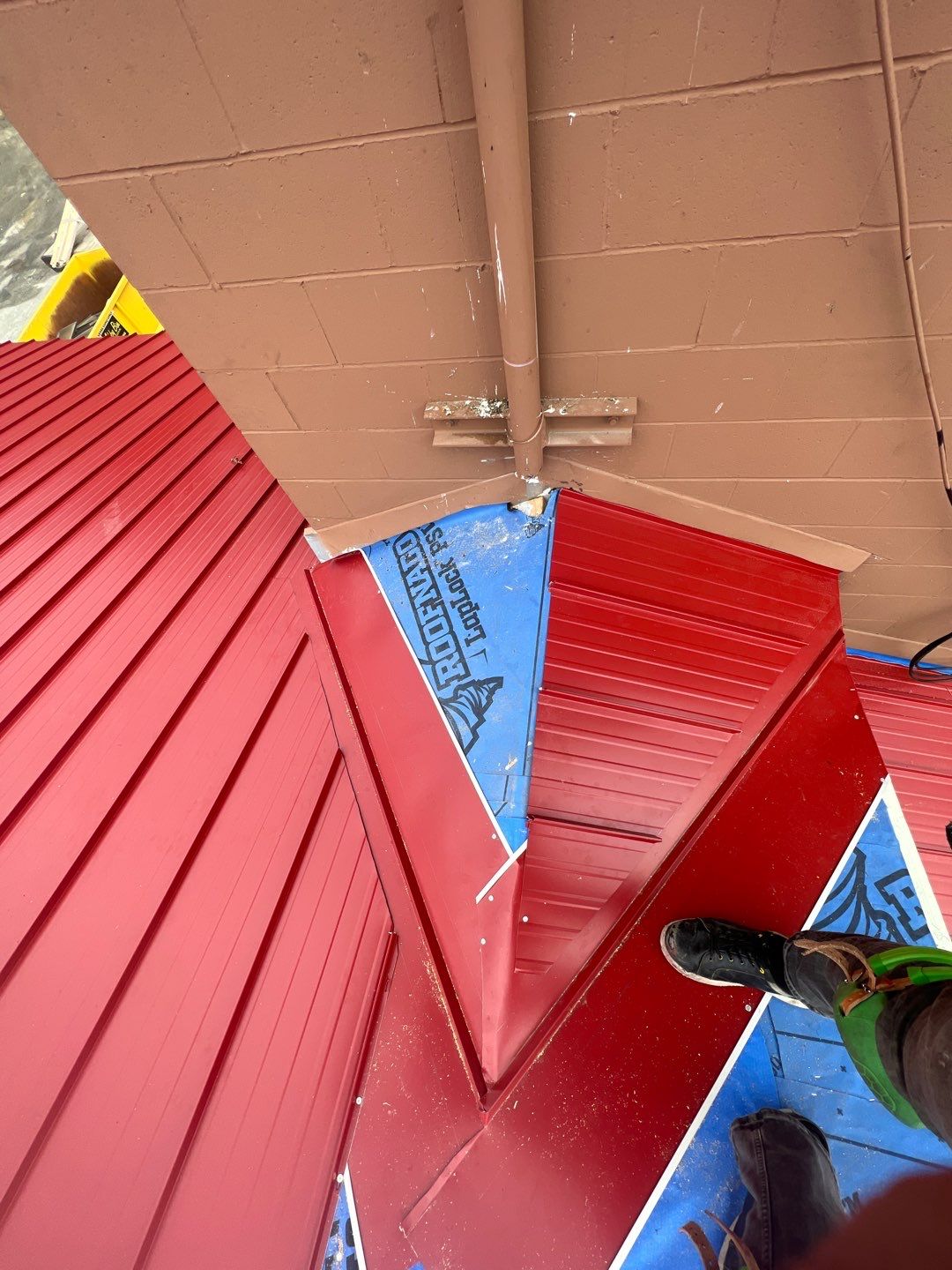 Commercial Roofing Installation using 12" Prolok metal  by Top Notch Roofing Inc