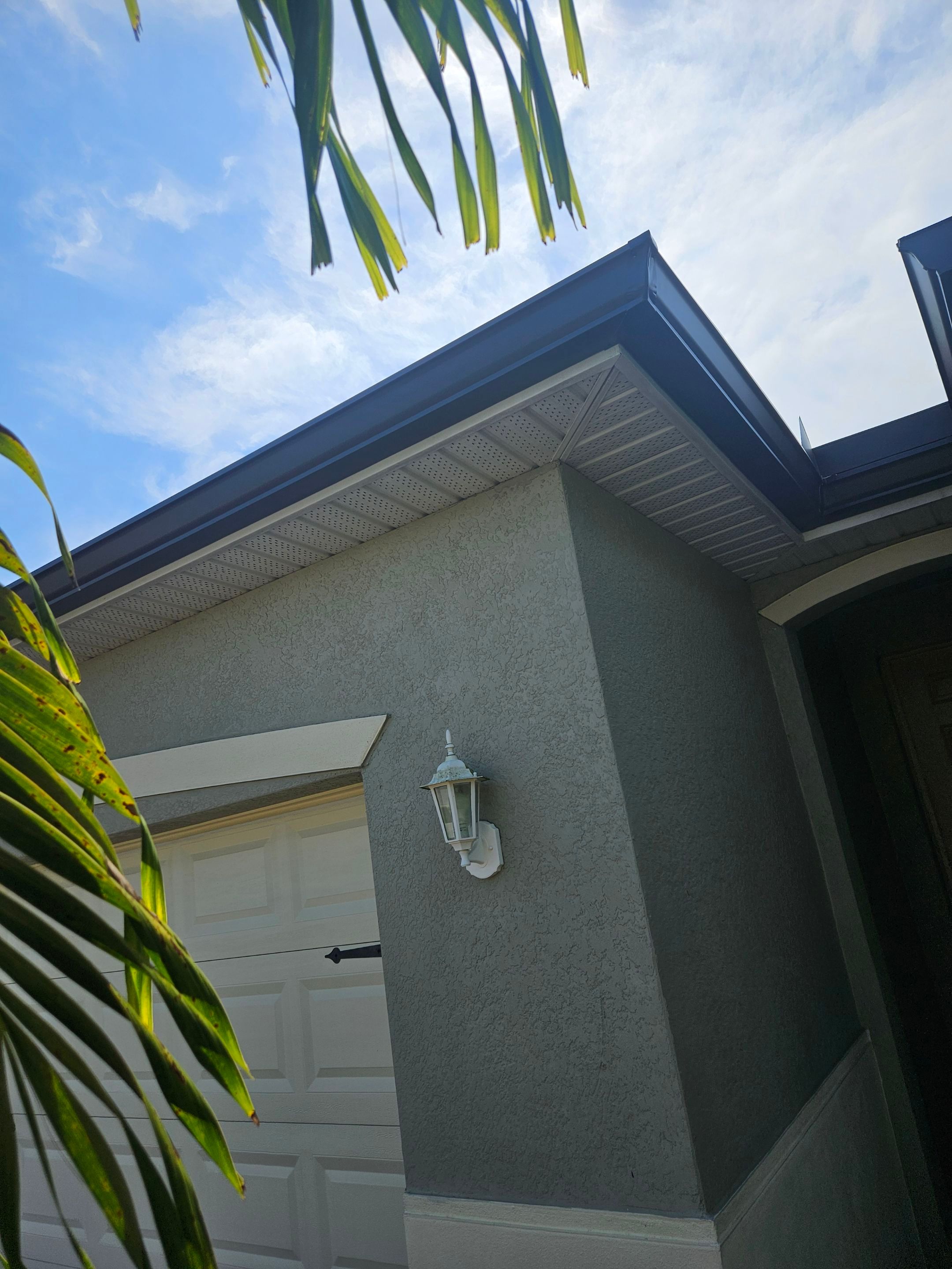 6-inch Seamless Aluminum Gutter Installation using Bronze gutters and Downspouts in Cape Coral FL by Gutter Professors