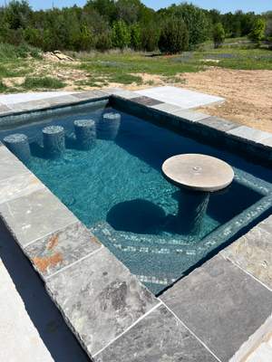 Geometric Pool with Tanning Ledge and Fire Feature