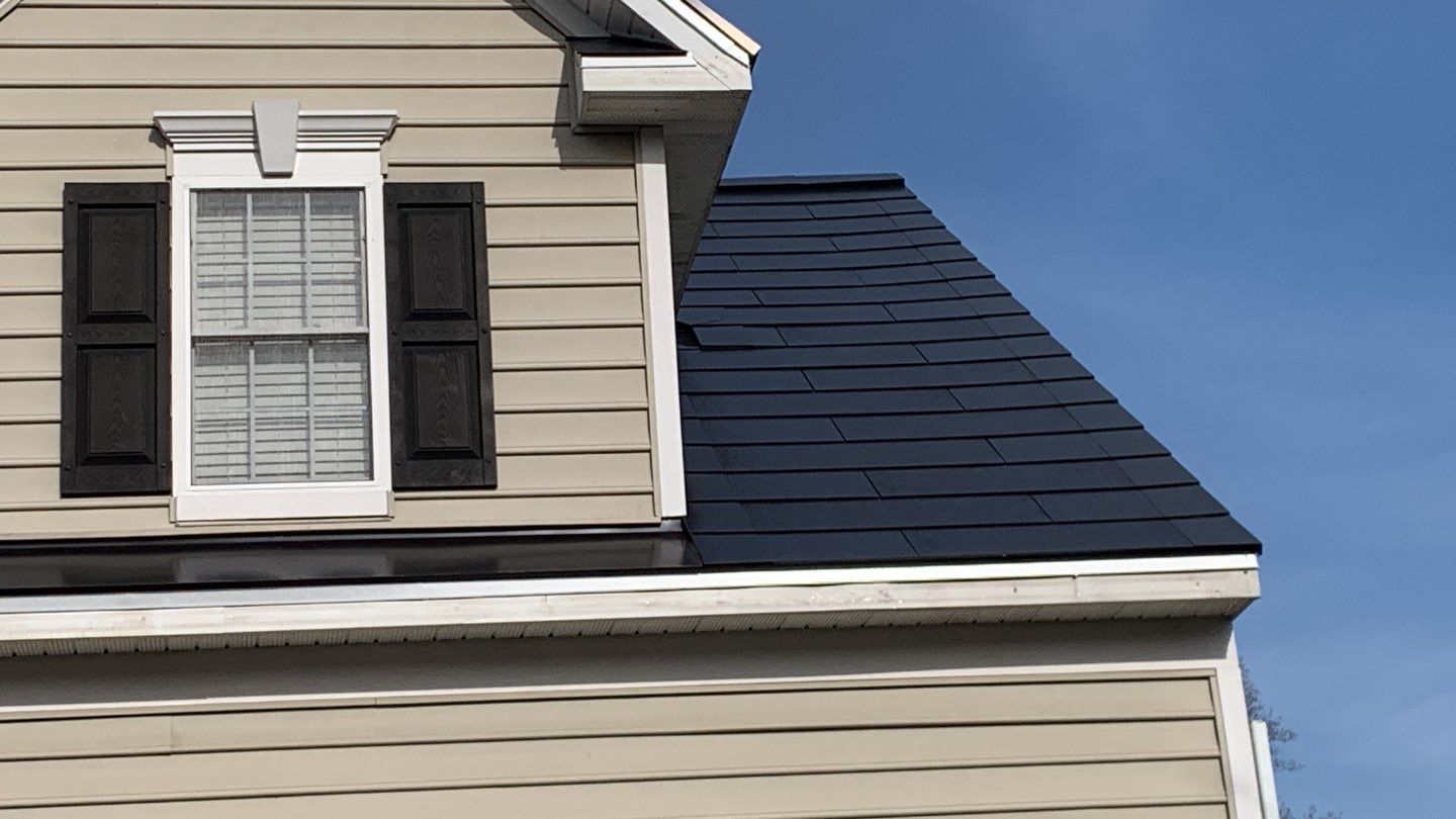Tesla Solar Roof and Gutter Installation by American Home Contractors