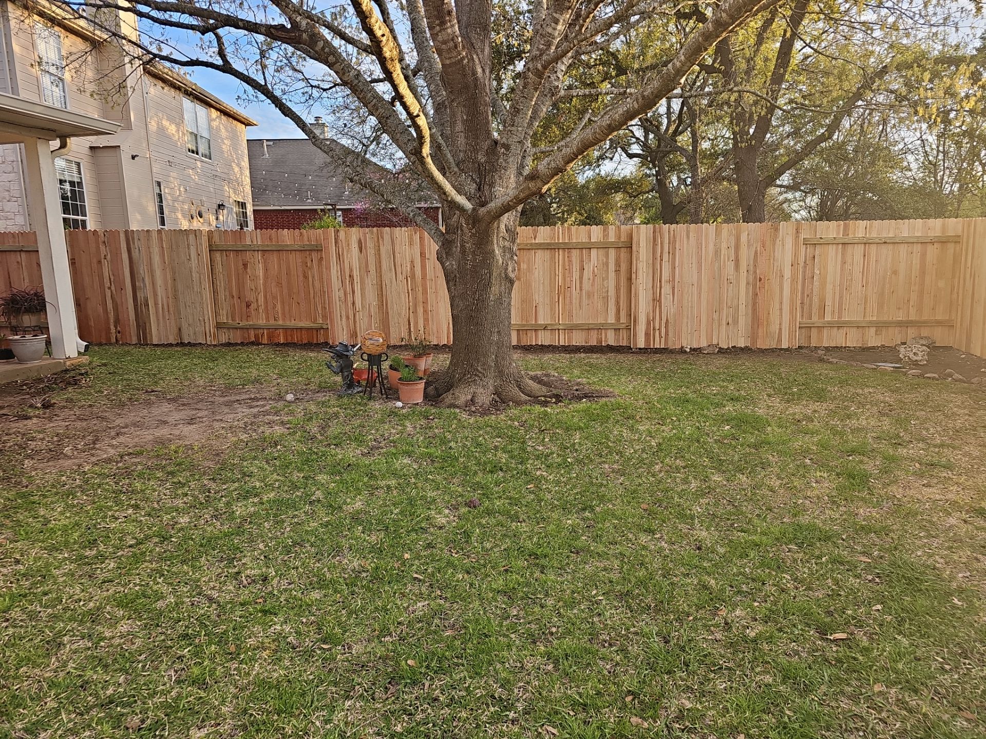 Fence Installation using Cedar Pickets by DeZign Roofing & Exteriors