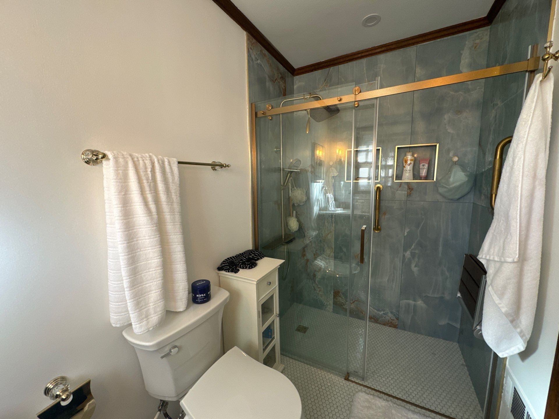 Modern Riverdale Bathroom Renovation Featuring Walk-In Marble Tile Shower by Swift Home Renovations
