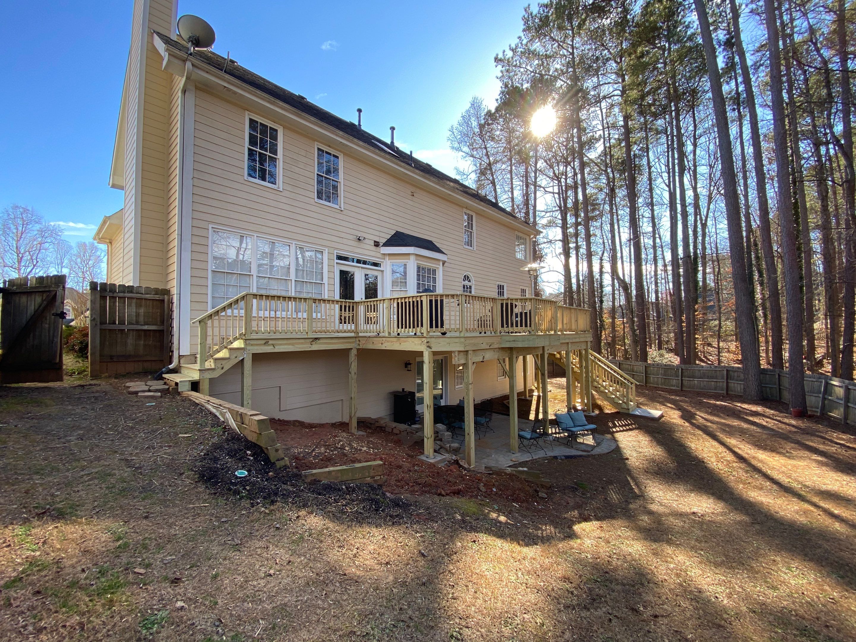 Elevated Pressure-Treated Wood Deck Replacement and Staircase in Duluth by Swift Home Renovations