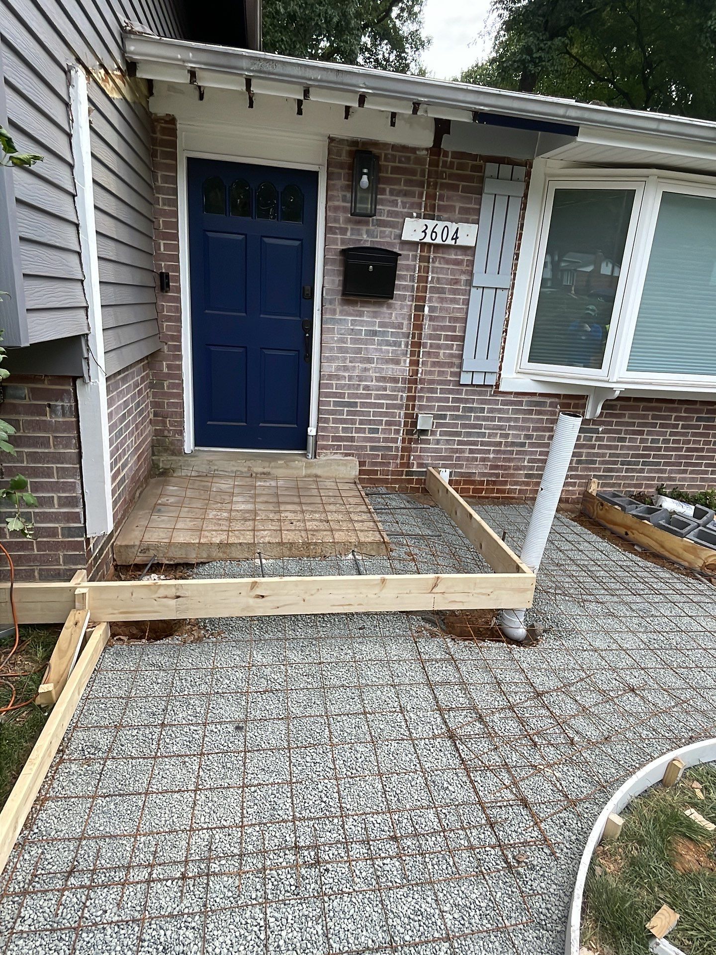 New walkway with stairs and a new front porch by Fairfax Contractors, LLC