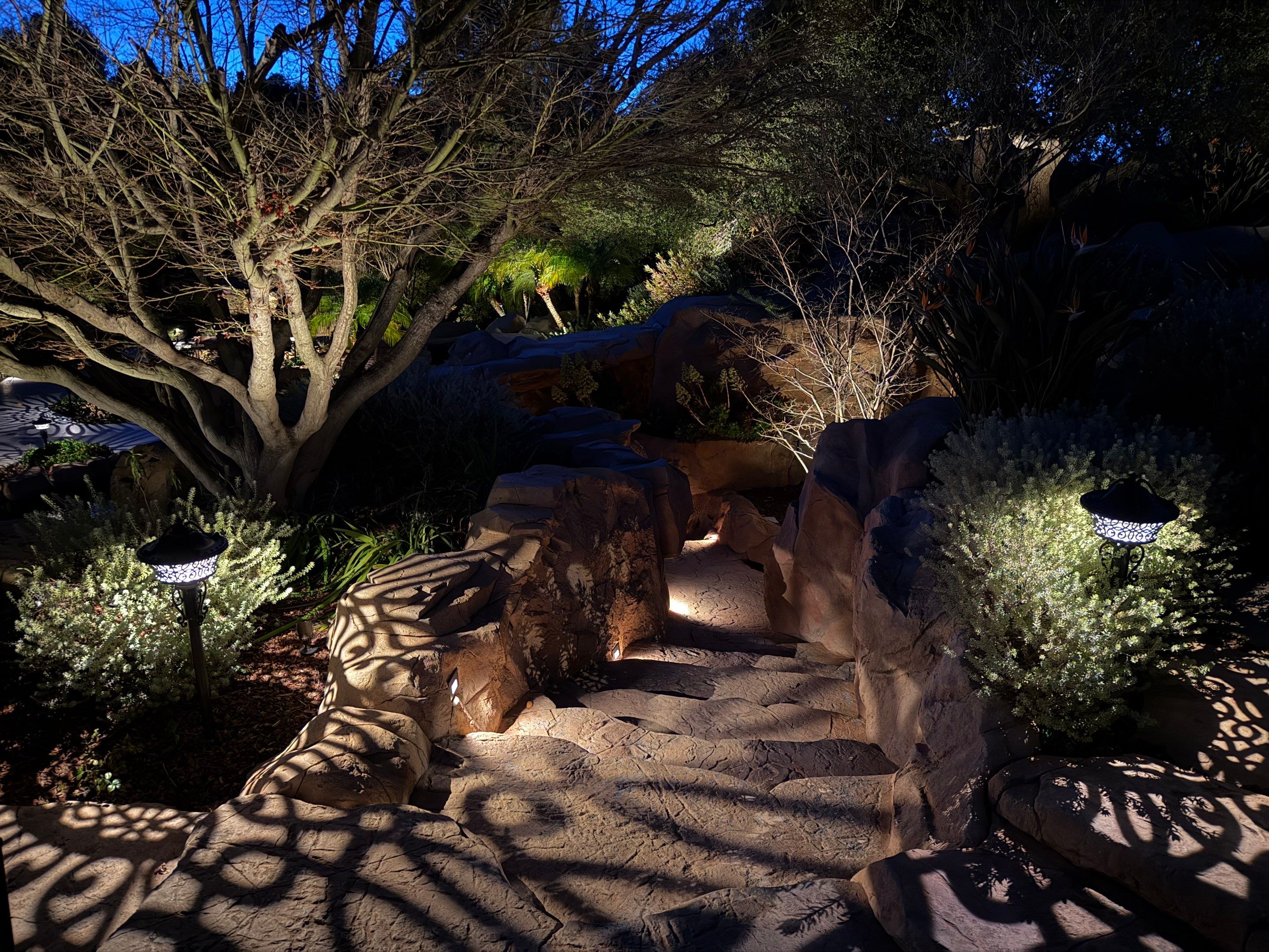 Tudor Estate Landscape Lighting with Integrated Stone Step Illumination by Outdoor Lights + Shades