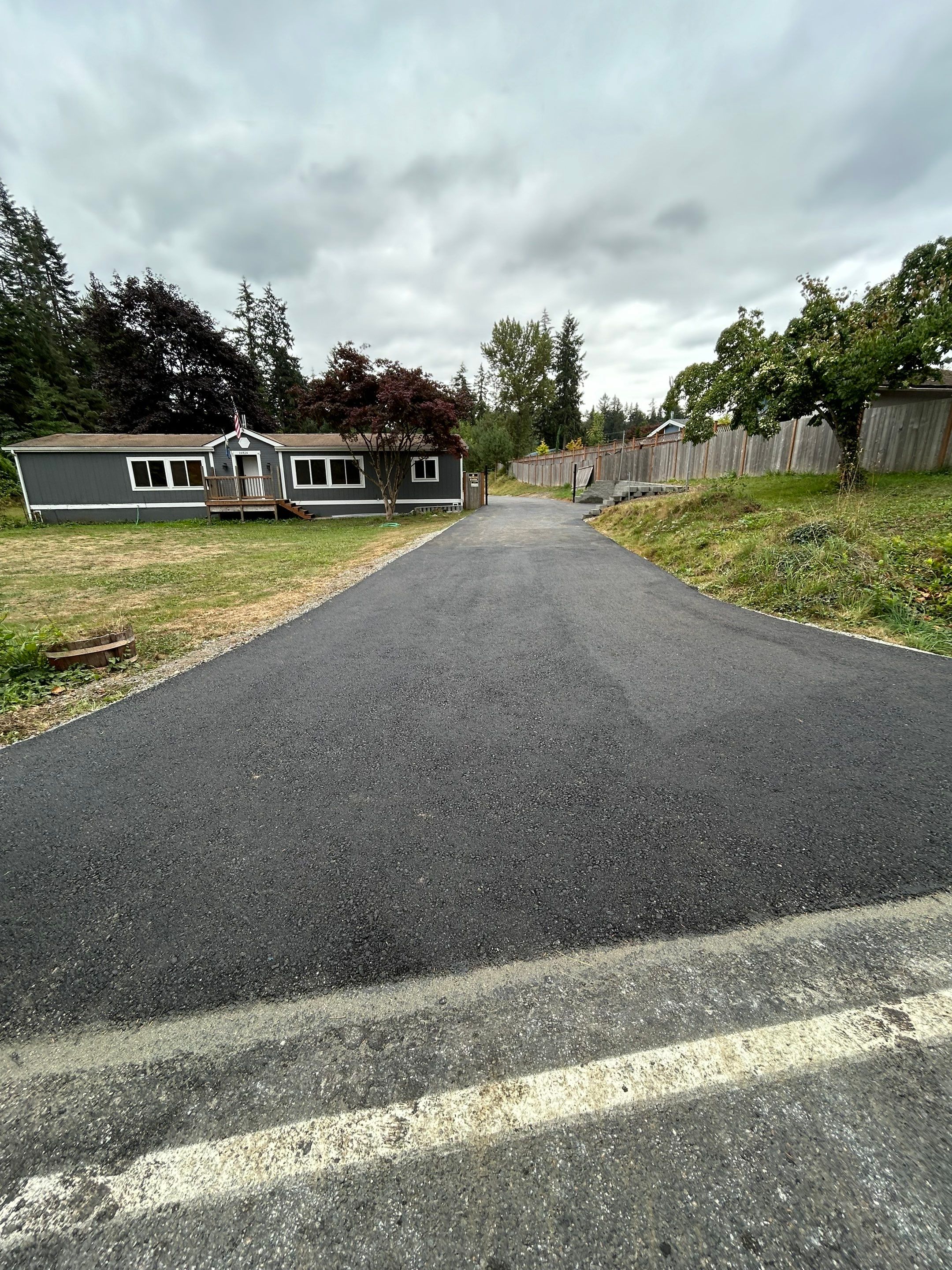 Joann | Asphalt Driveway & Retaining Wall  by Jireh Asphalt & Concrete Inc 