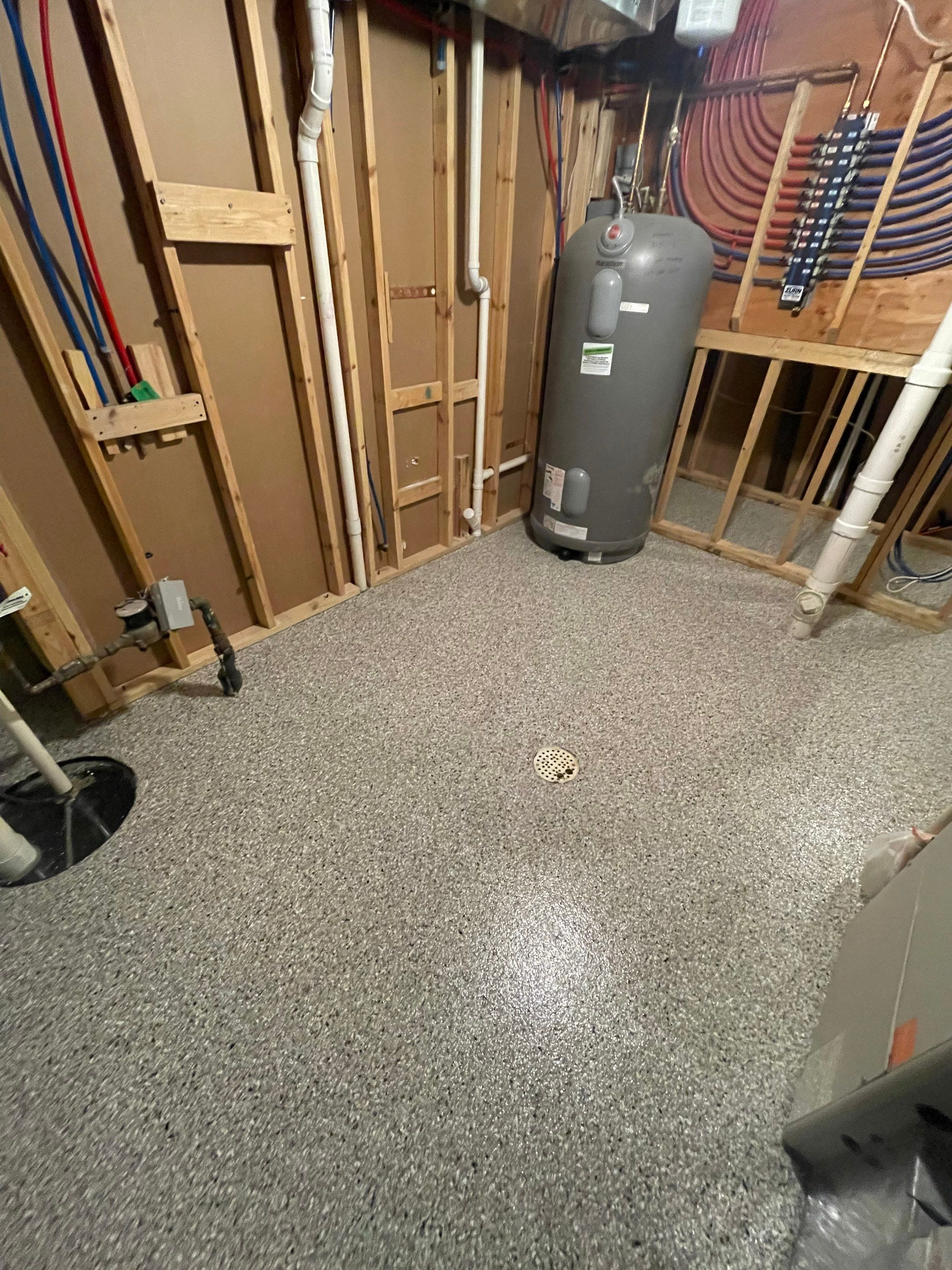 Sioux Falls Basement Floor Transformation with Durable Epoxy Flake Coating by Select Painting, Coatings & Garage Cabinets