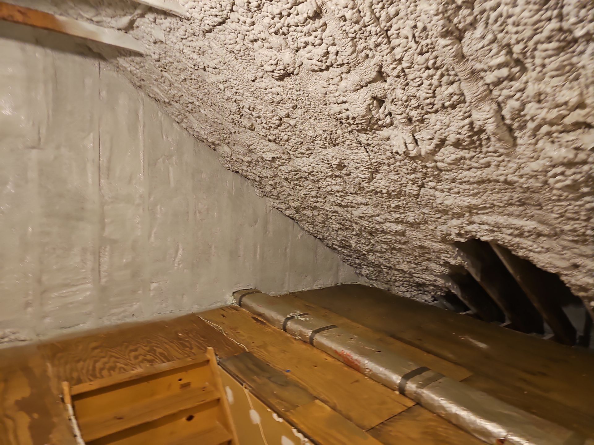 Attic Retrofit using open cell spray foam by NYS Foam & Energy