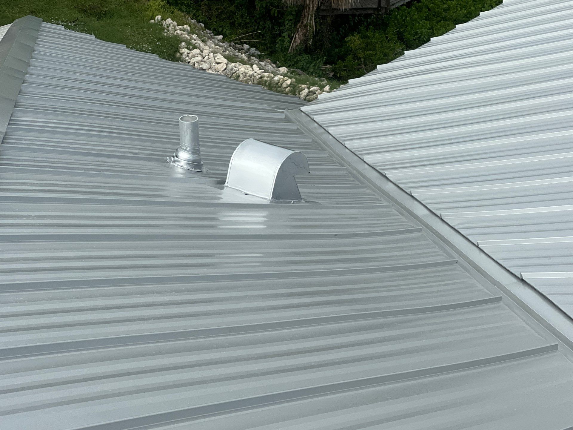 Residential Roofing Installation using Galvalume Standing Seam by Durabilis Roofing INC