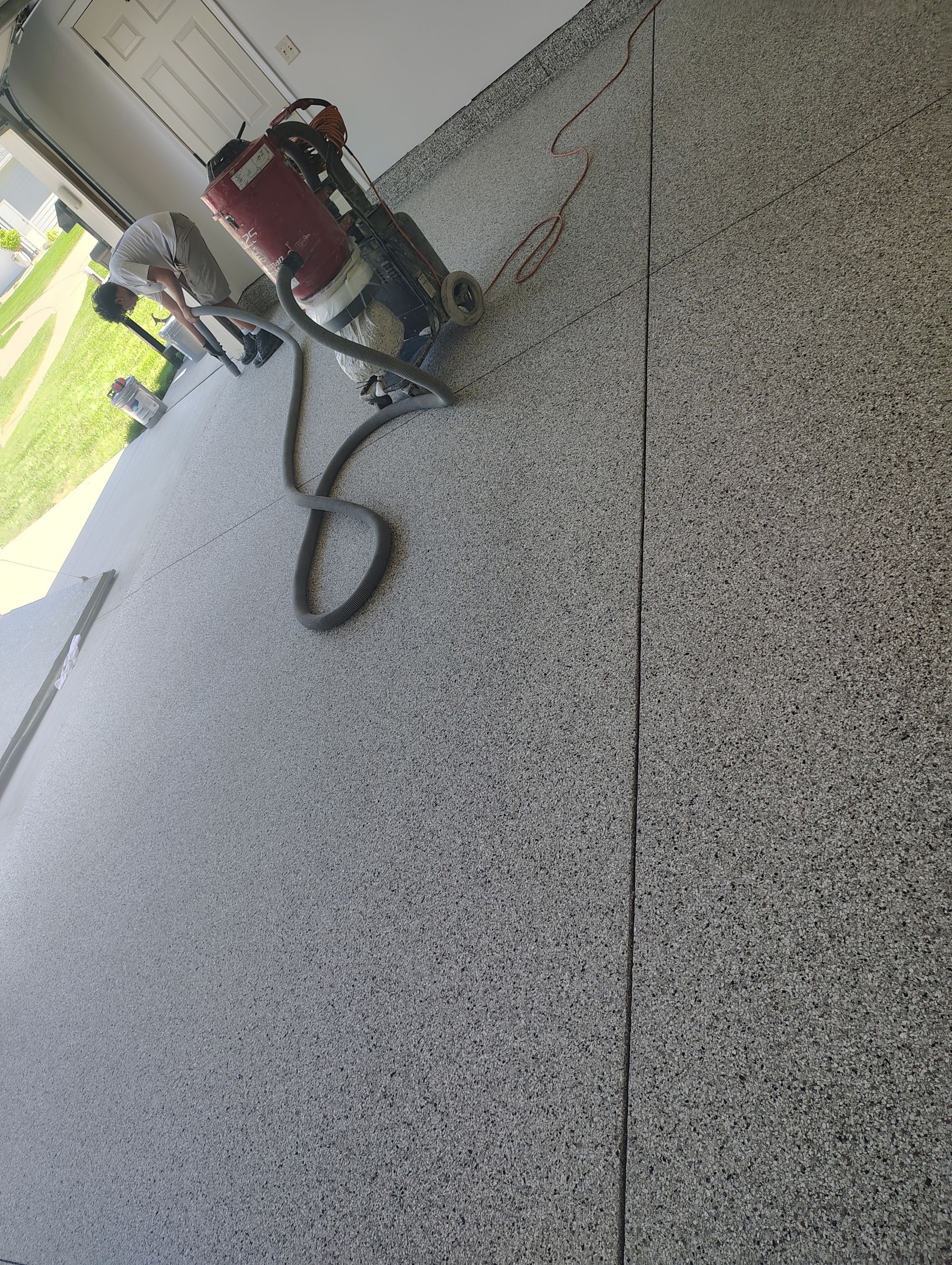 Custom Grey Speckled Epoxy Floor Coating for Sioux Falls Garage by Select Painting, Coatings & Garage Cabinets