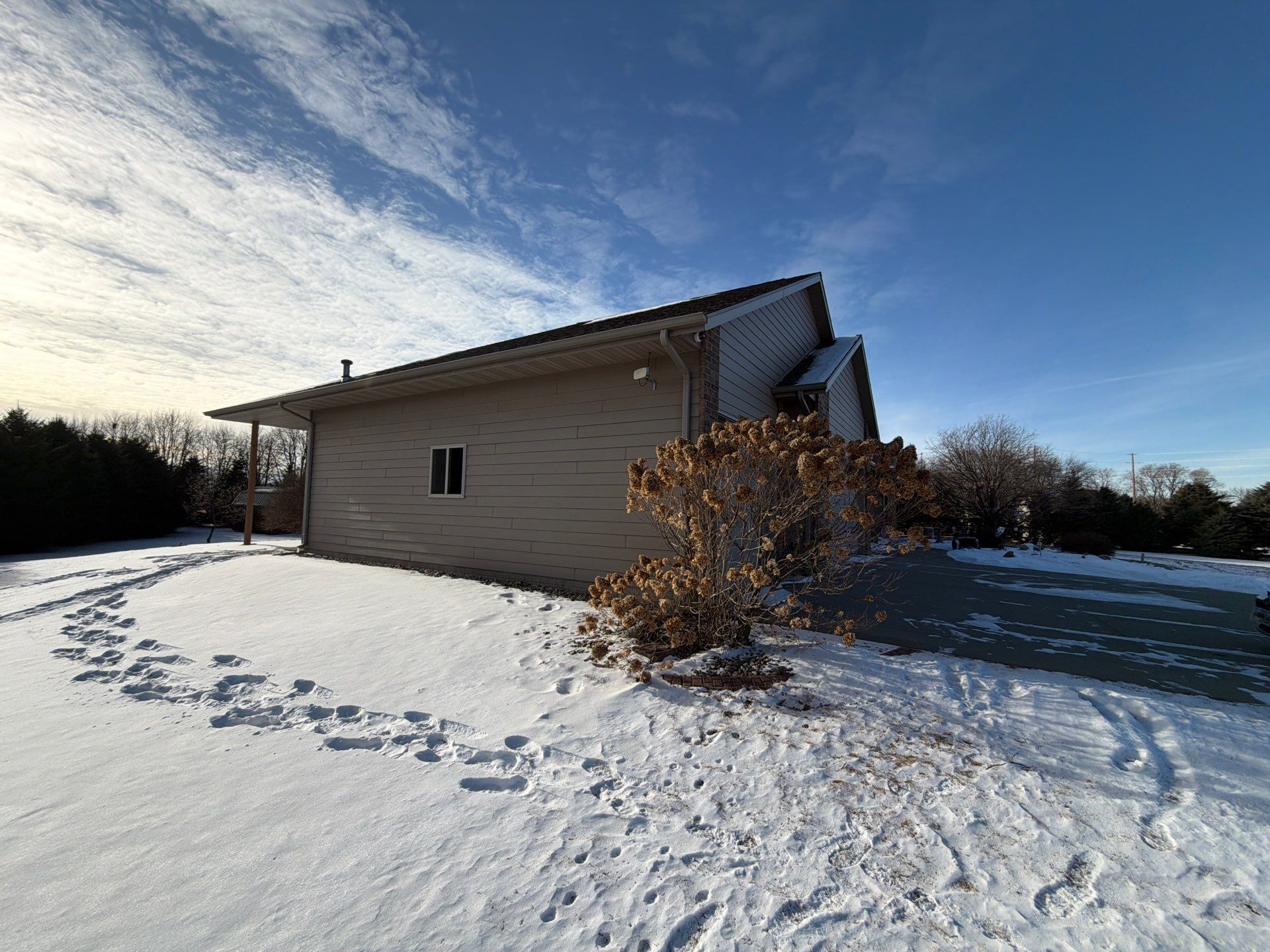 Full Exterior Siding Transformation and Trim Update in Garretson by Select Painting, Coatings & Garage Cabinets