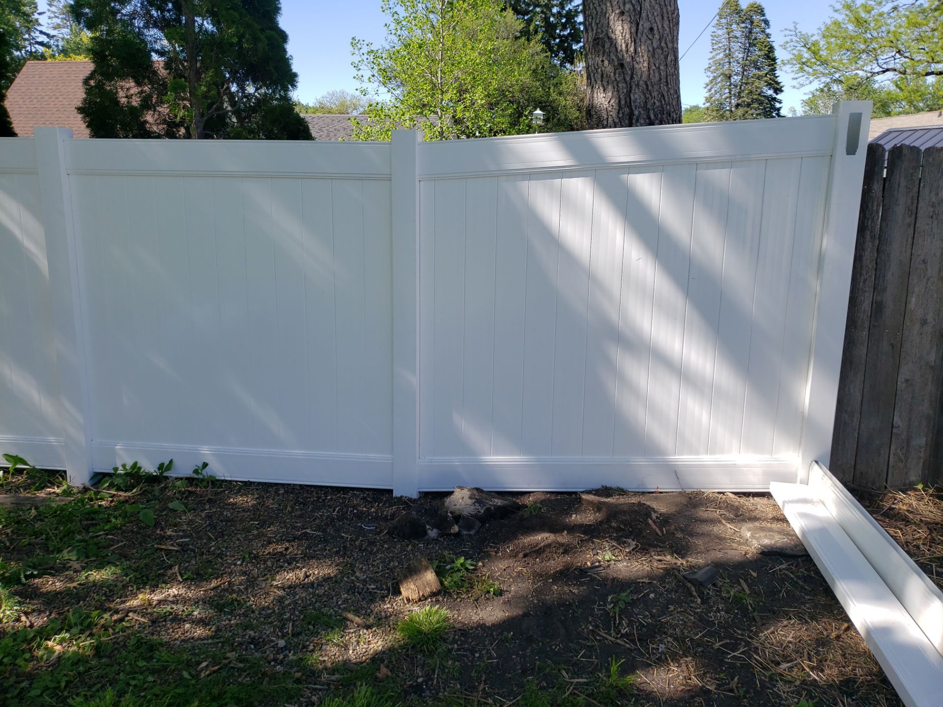 Residential White Vinyl Privacy Fence Installation in Waterloo by Perfect Picket Fence and Stain