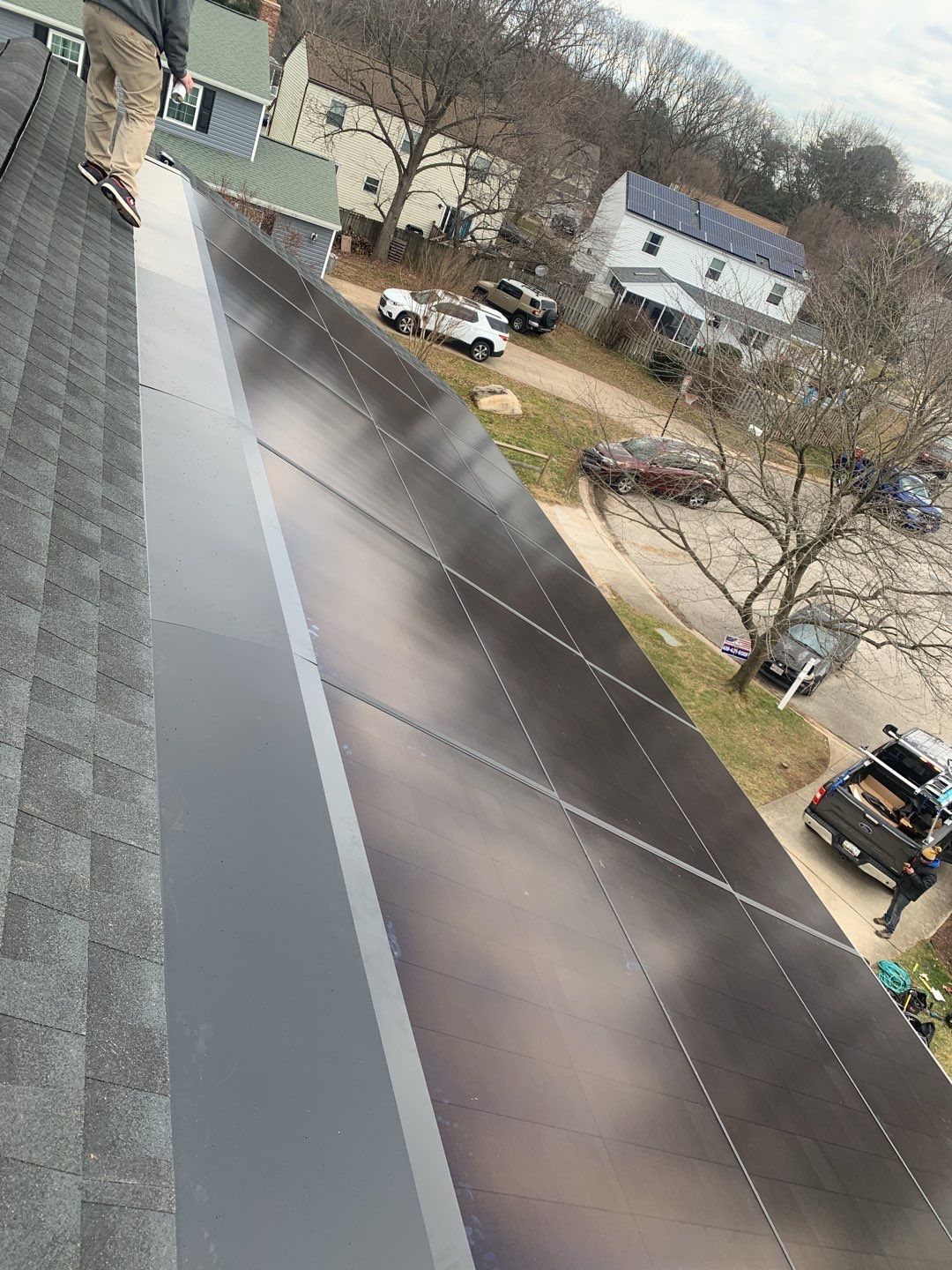 Roof Replacement with GAF Decotech integrated solar panels by American Home Contractors