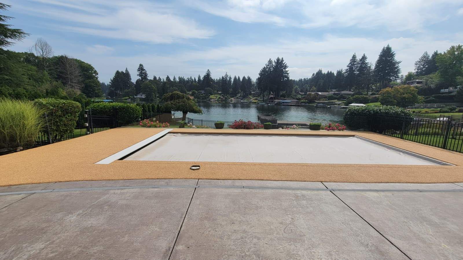 Pool Deck with Rubber Stone Finish by Concrete Coating Experts Inc.