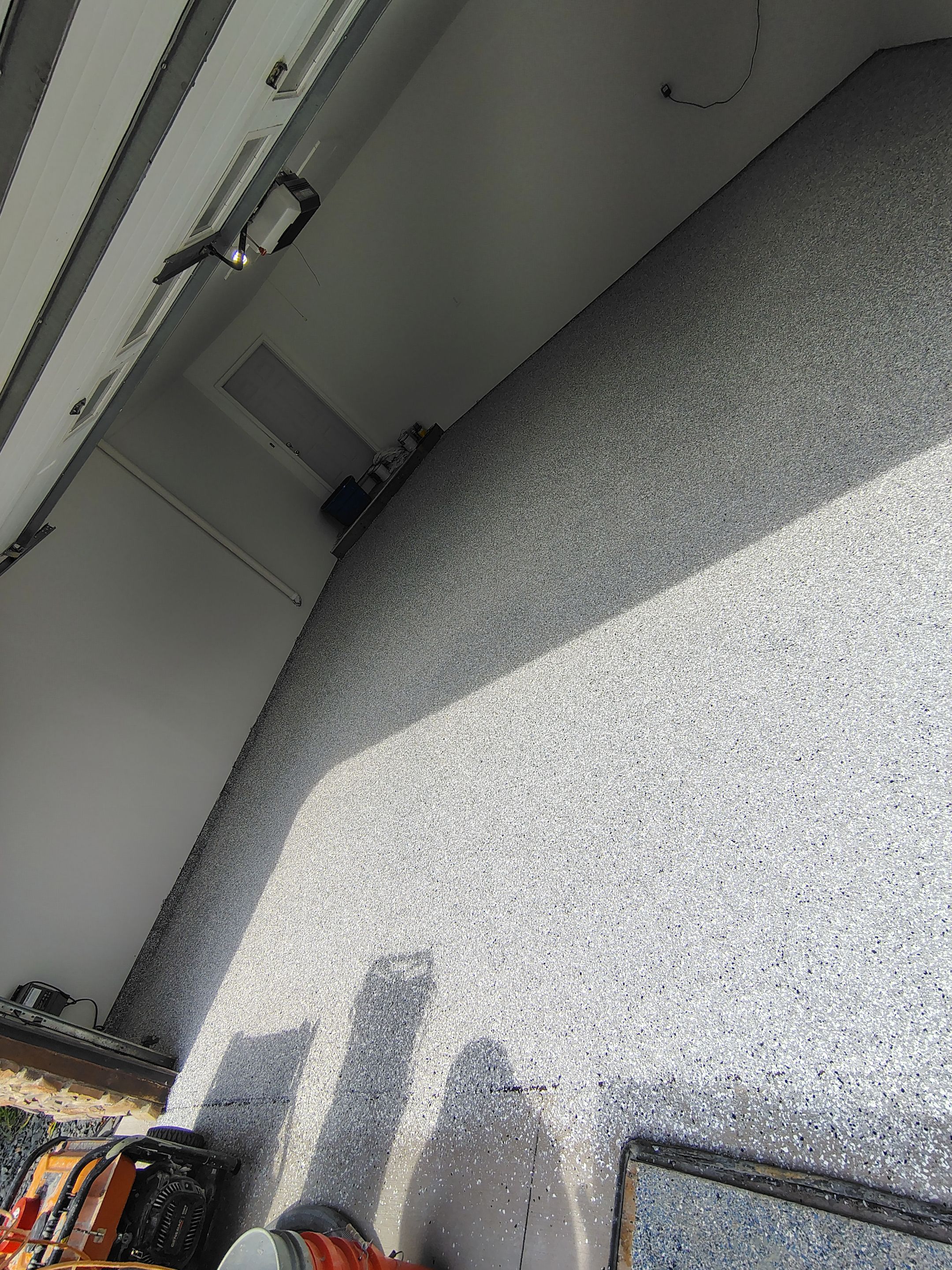 Sioux Falls Garage Floor Coating with Speckled Flake Finish by Select Painting, Coatings & Garage Cabinets