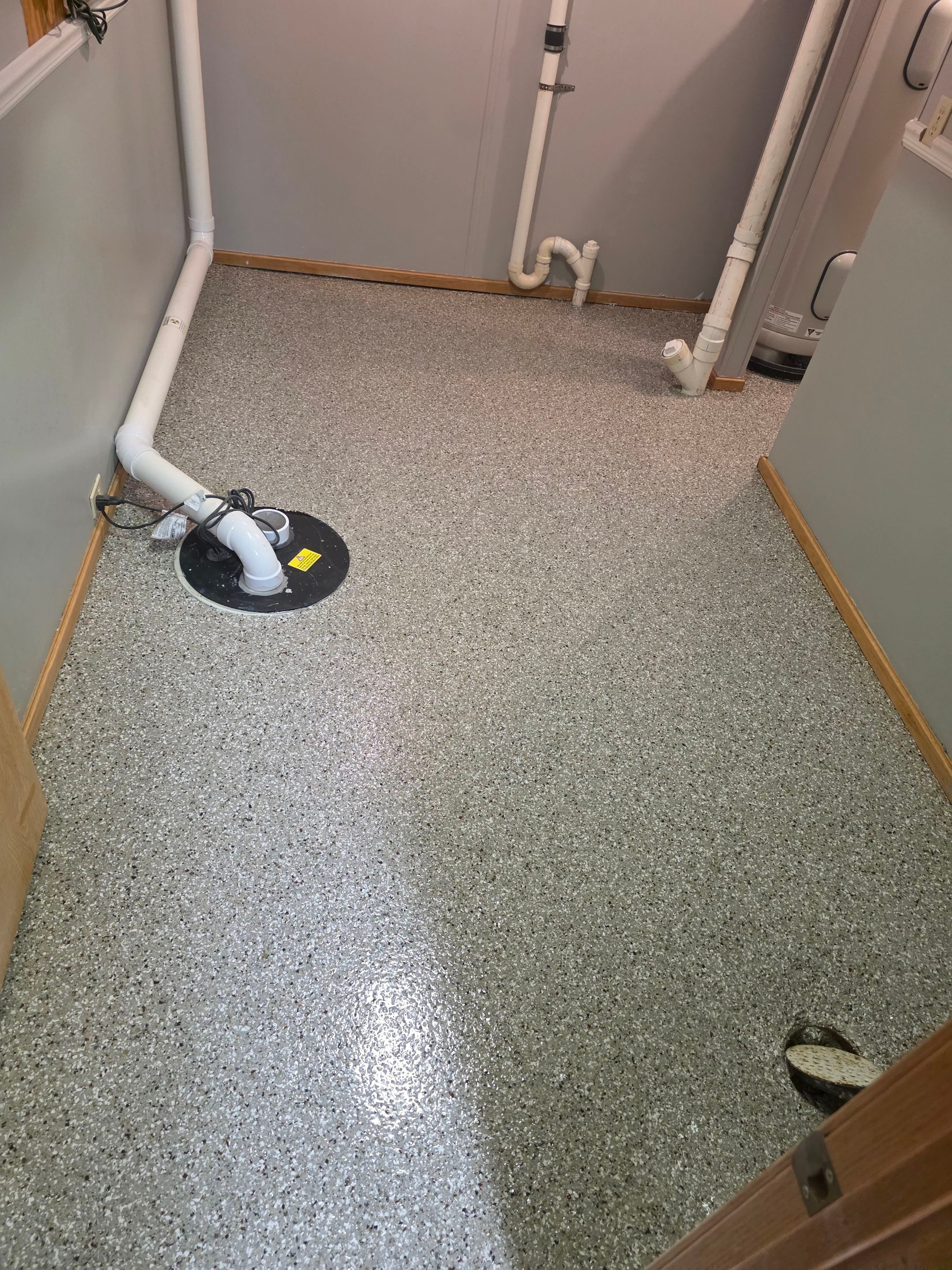 Full Garage and Basement Epoxy Floor Coating in Winner by Select Painting, Coatings & Garage Cabinets