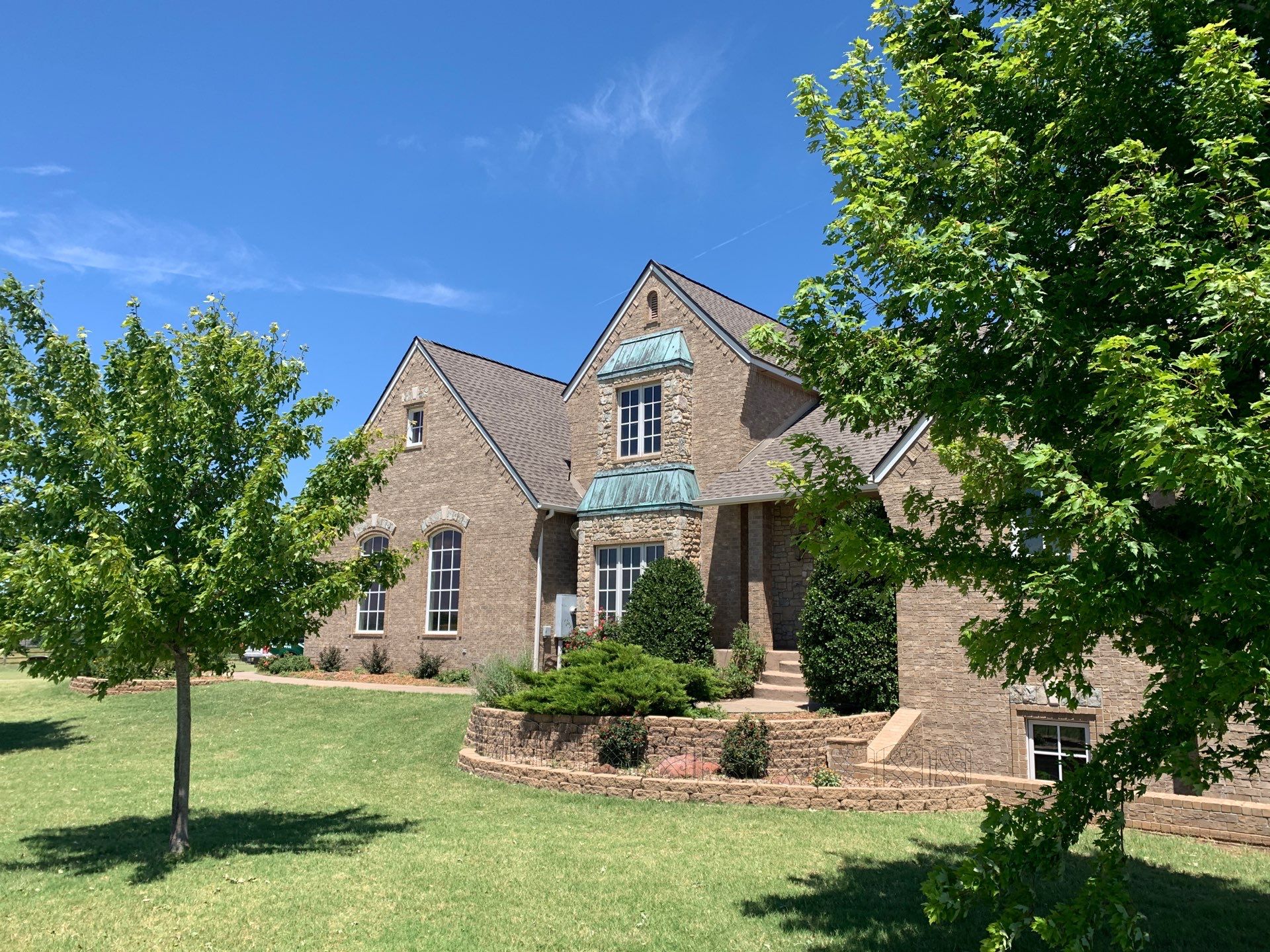 Roof Replacement and Gutter Installation in Edmond, OK by McCann's Roofing and Construction