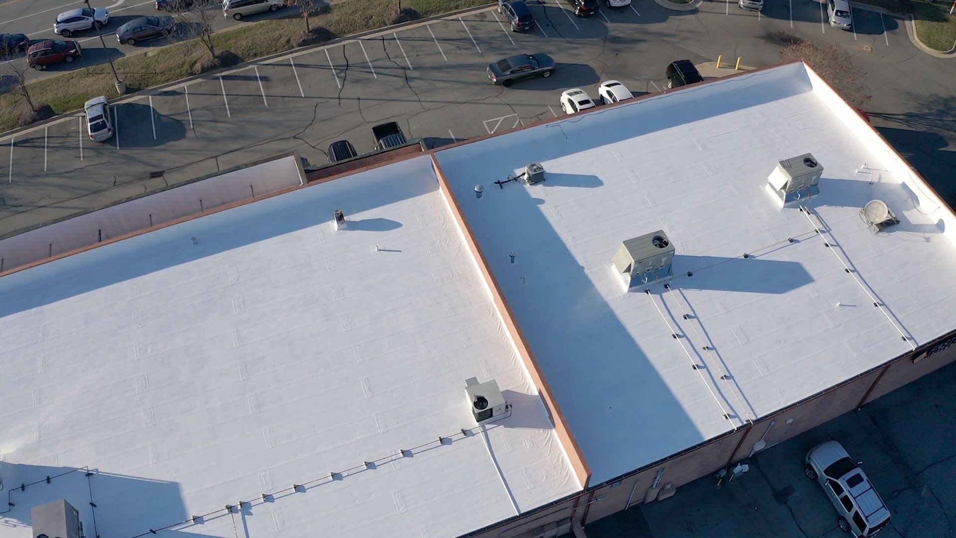 Commercial Coating using Poly Urerthane and Silicone Coating by Just In Time Roofing and Restoration