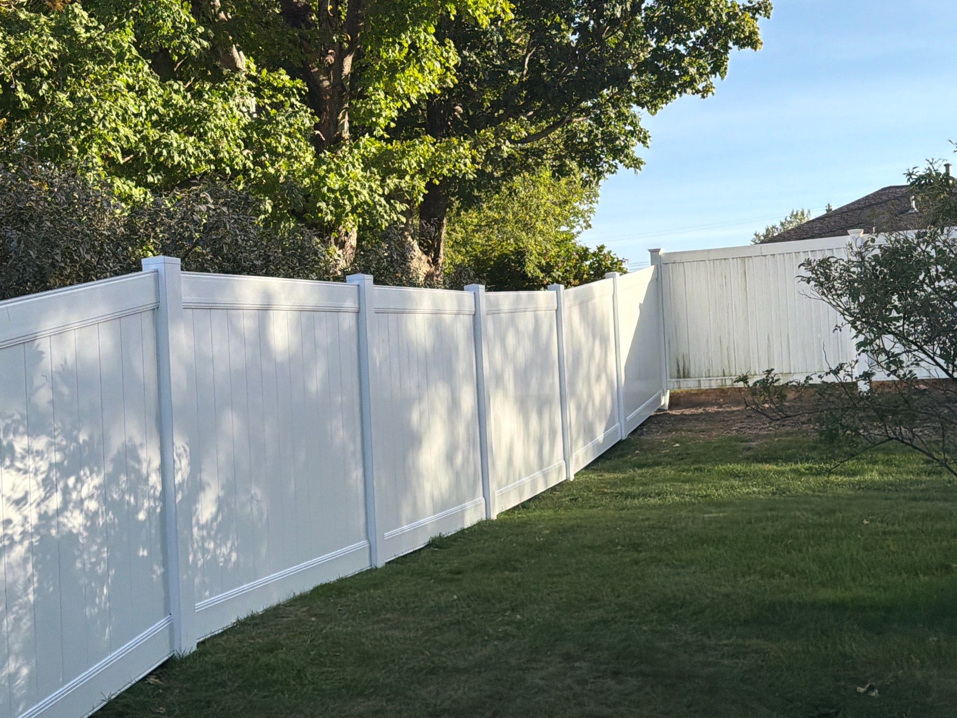 White Vinyl Privacy Fence and Gate Installation in Grundy Center by Perfect Picket Fence and Stain