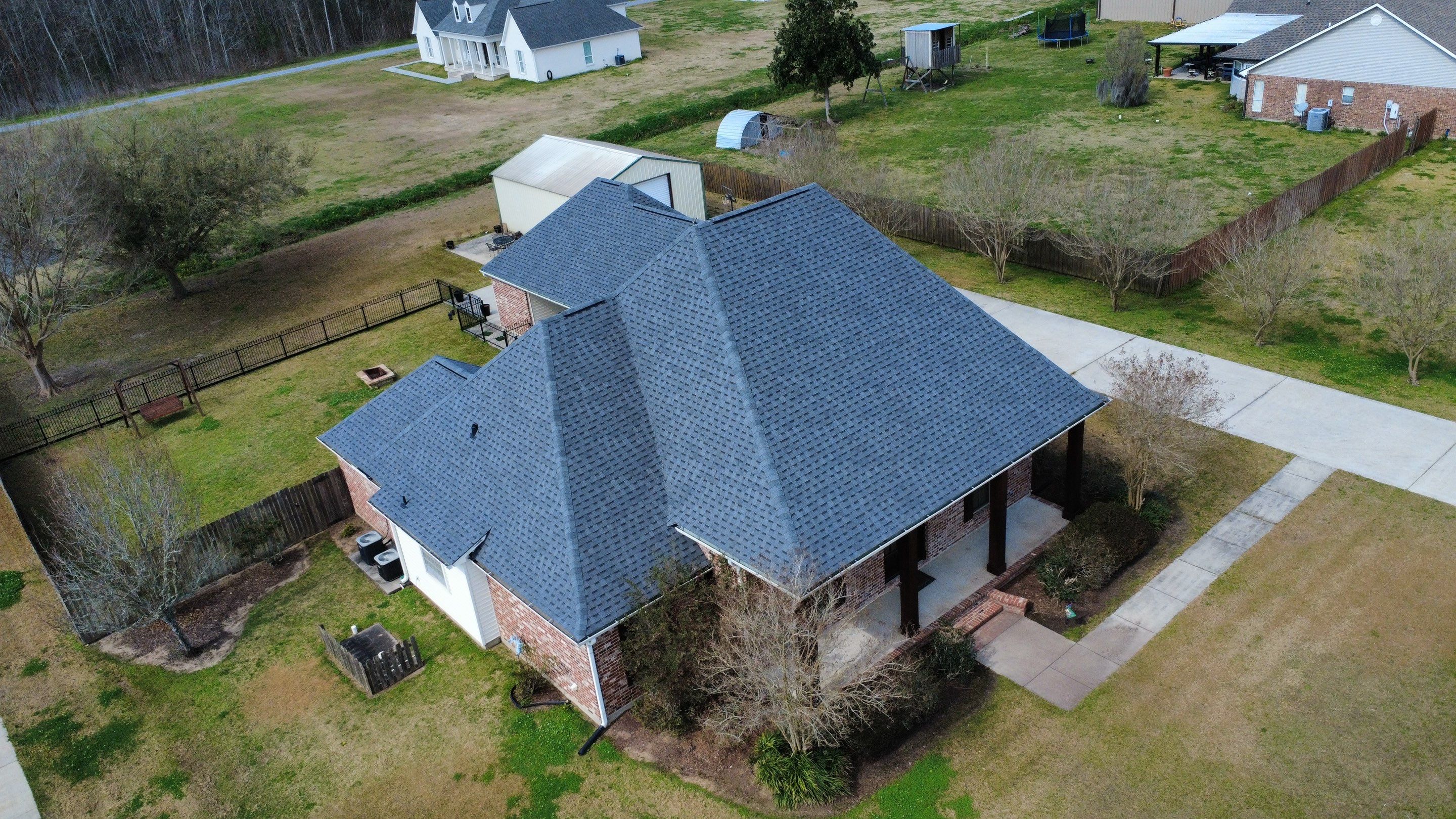 Residential roof installation in Plaquemine, LA using Atlas Pinnacle Pristine Pewter shingles  by Top Team Roofing & Construction