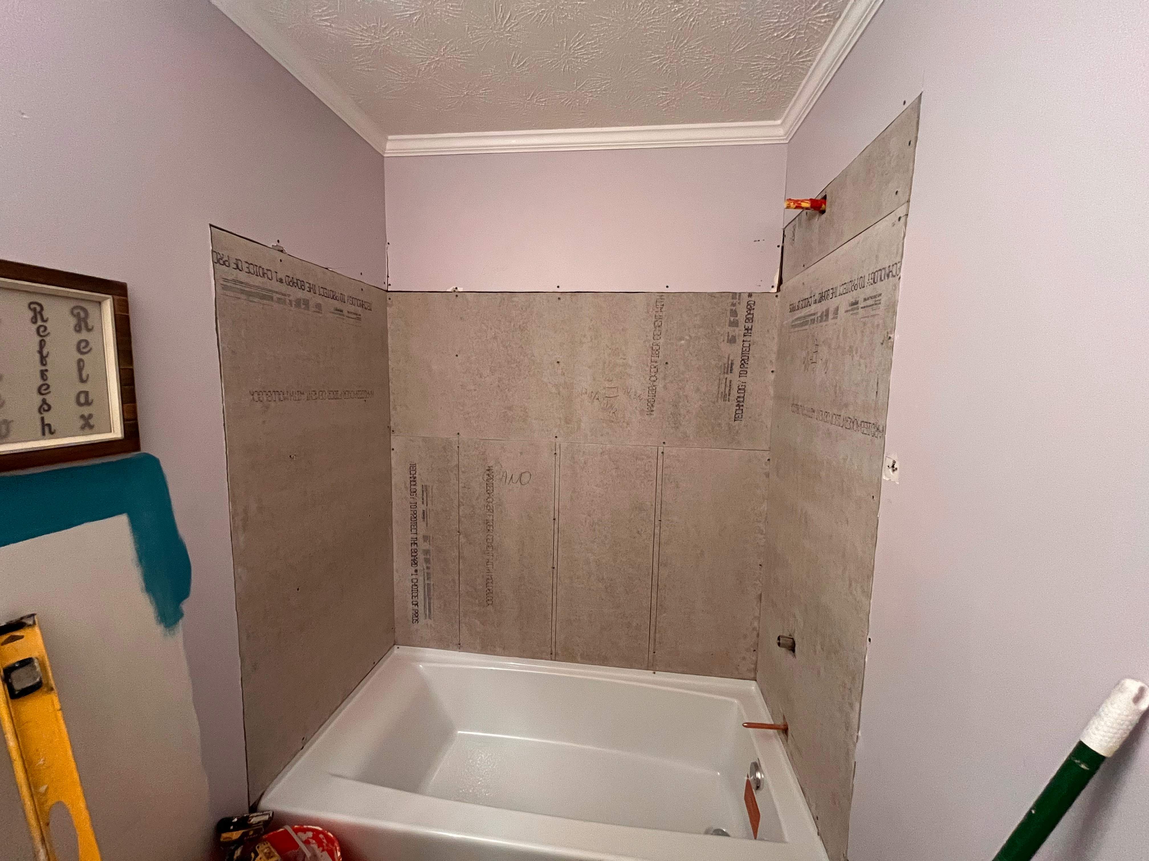 Guest bathroom tub and flooring by Prudencio