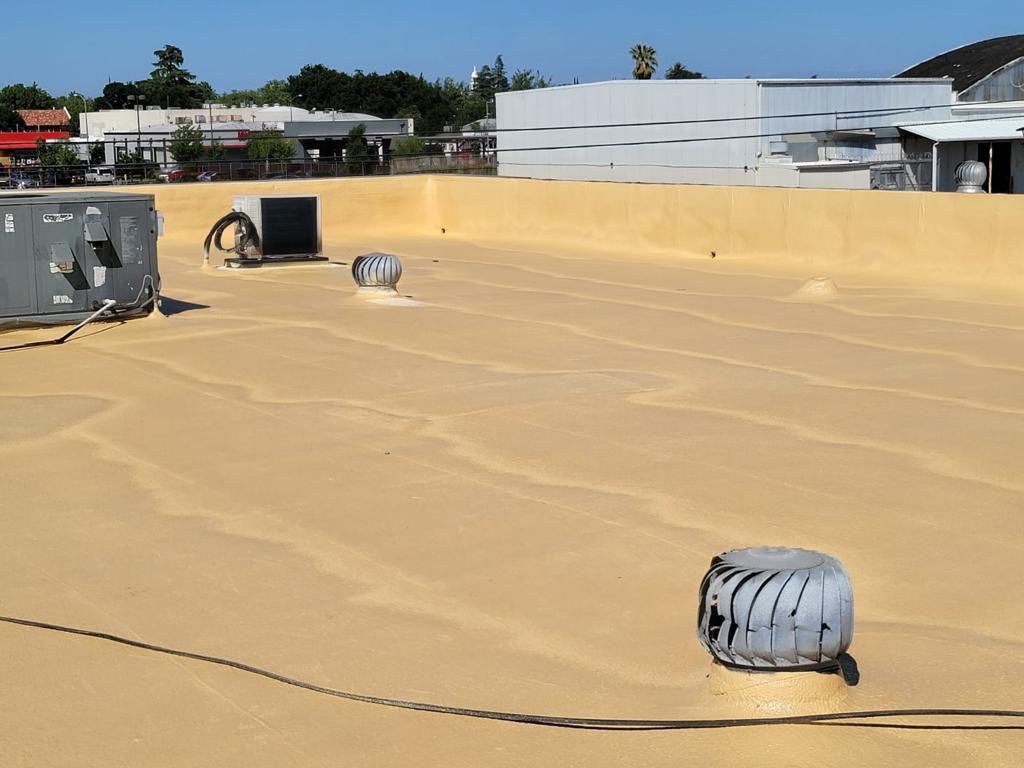 Spray foam and coatings using Conklin Benchmark/PUMA XL coatings and spray foam by Straight Edge Roofing Inc