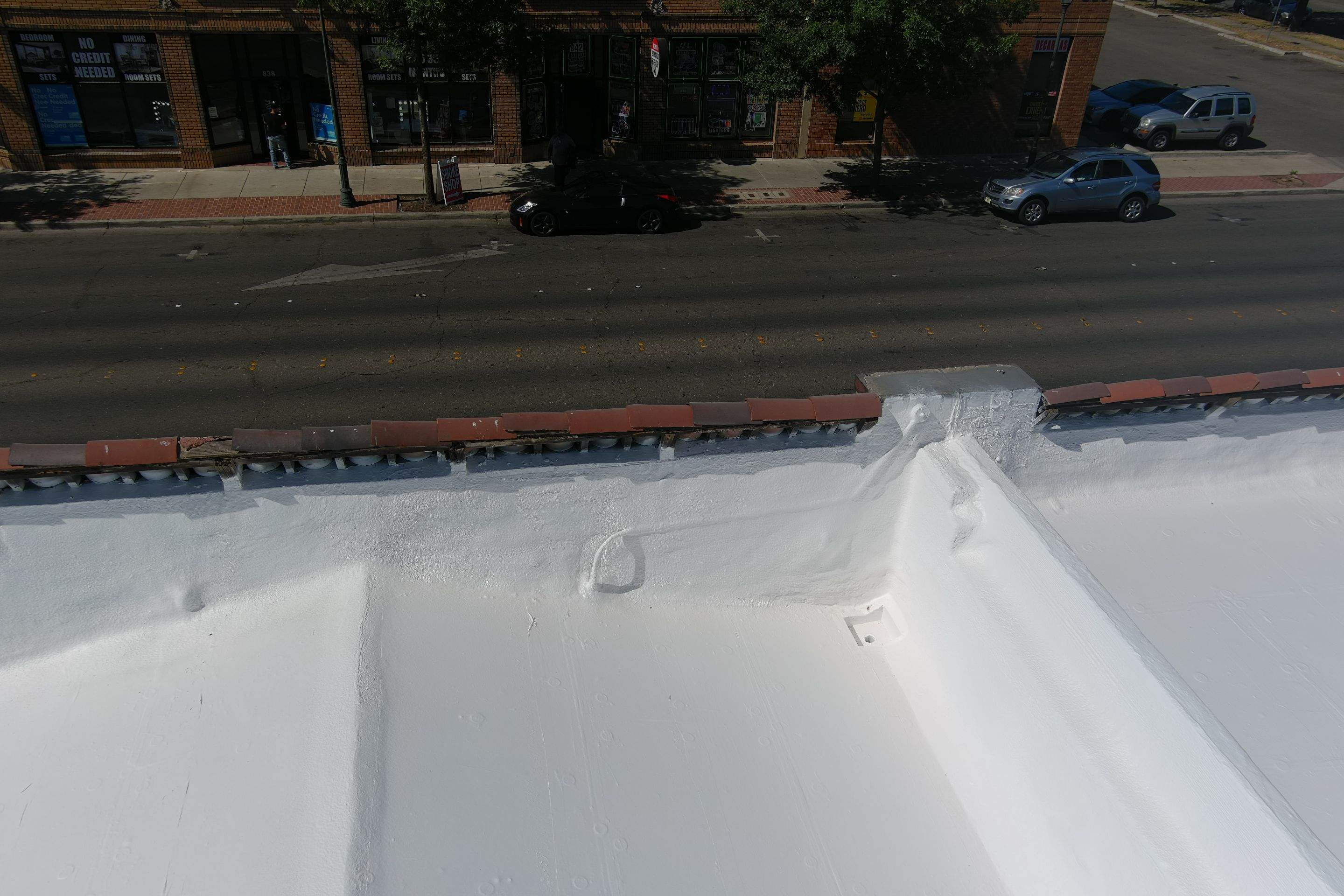 Commercial Roofing Installation using Conklin BenchPly system with PUMA top coat (imbedded fabric system) by Straight Edge Roofing Inc